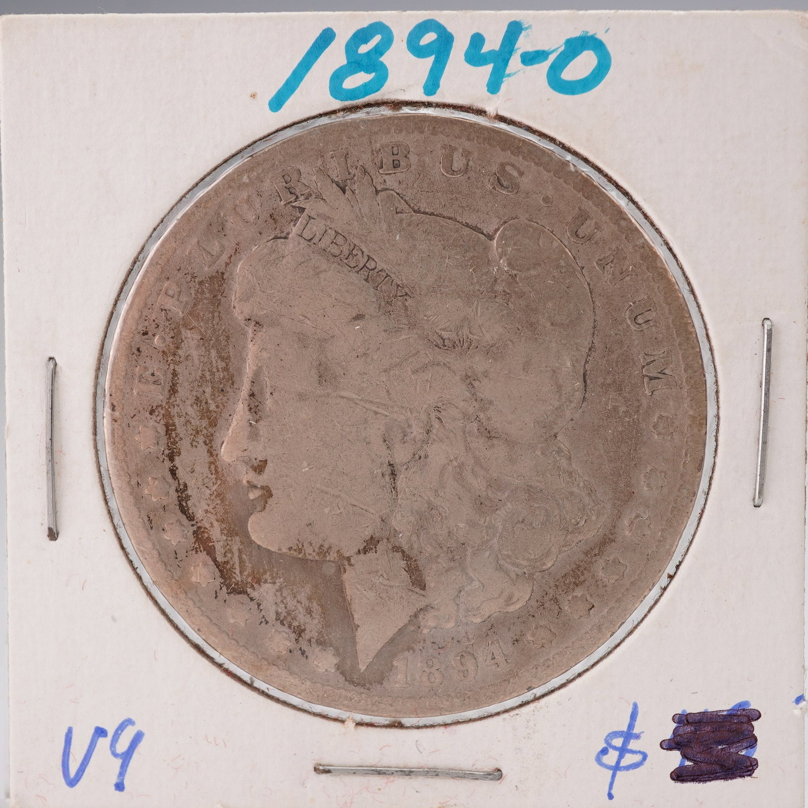 1894-O Morgan Silver Dollar: Struck at the New Orleans Mint. The obverse features a profile portrait of Liberty wearing a Phrygian cap adorned with wheat and cotton, along with the inscription E PLURIBUS UNUM and the date 1894. T