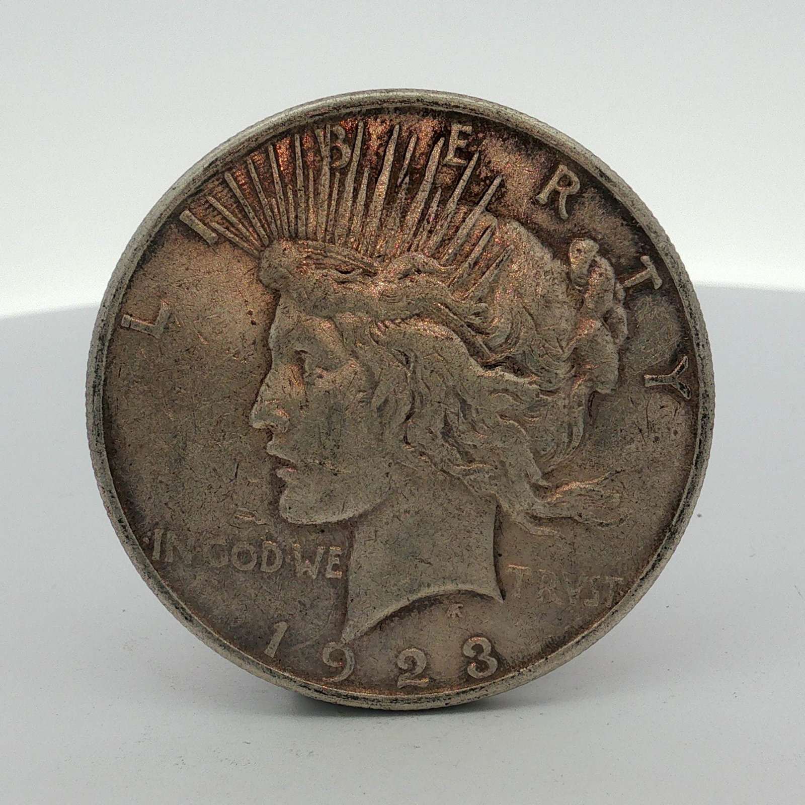1923-S US One Dollar Peace Silver Dollar Coin, Circulated: US Peace silver dollar dated 1923. This specimen was struck at the San Francisco Mint, as indicated by the S mint mark located on the reverse. The coin is composed of 90 percent silver and 10 percent 