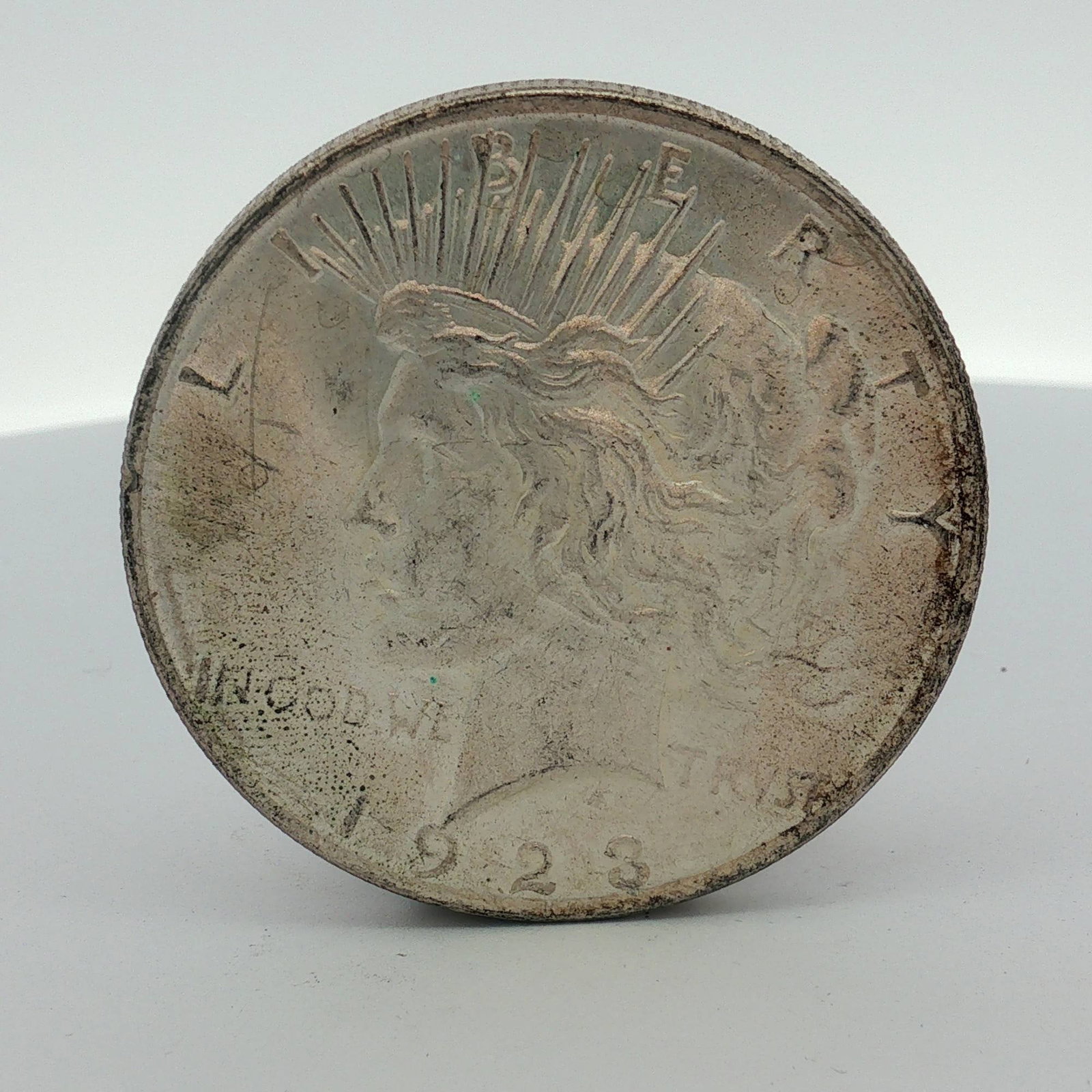 US 1923-S Peace Silver Dollar: A US 1923-S Peace silver dollar. This coin is struck in 90 percent fine silver. The obverse features the Peace dollar design and the date 1923. The reverse features the Peace dollar design and the S