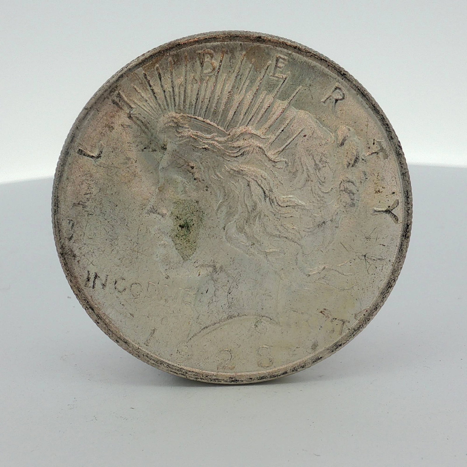 US 1923-S Peace Silver Dollar: This US silver Peace dollar was minted at the San Francisco mint, as indicated by the S mint mark on the reverse. The coin is struck in a composition of 90 percent silver and 10 percent copper. It