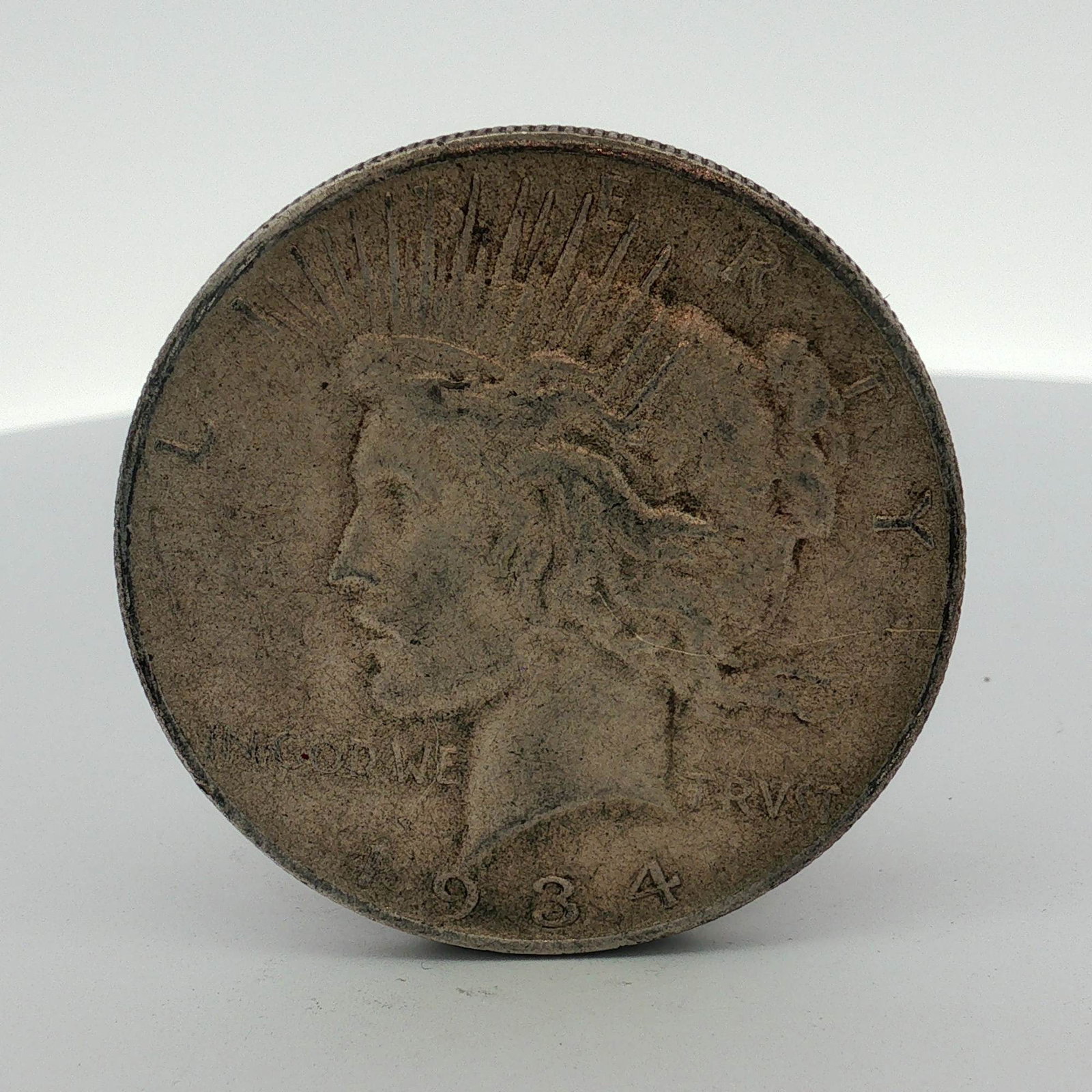 US 1934-S Peace Silver Dollar: This US 1934-S Peace silver dollar was struck at the San Francisco Mint. The obverse features the Peace dollar design type with the date 1934 and the inscription IN GOD WE TRVST. The reverse displays