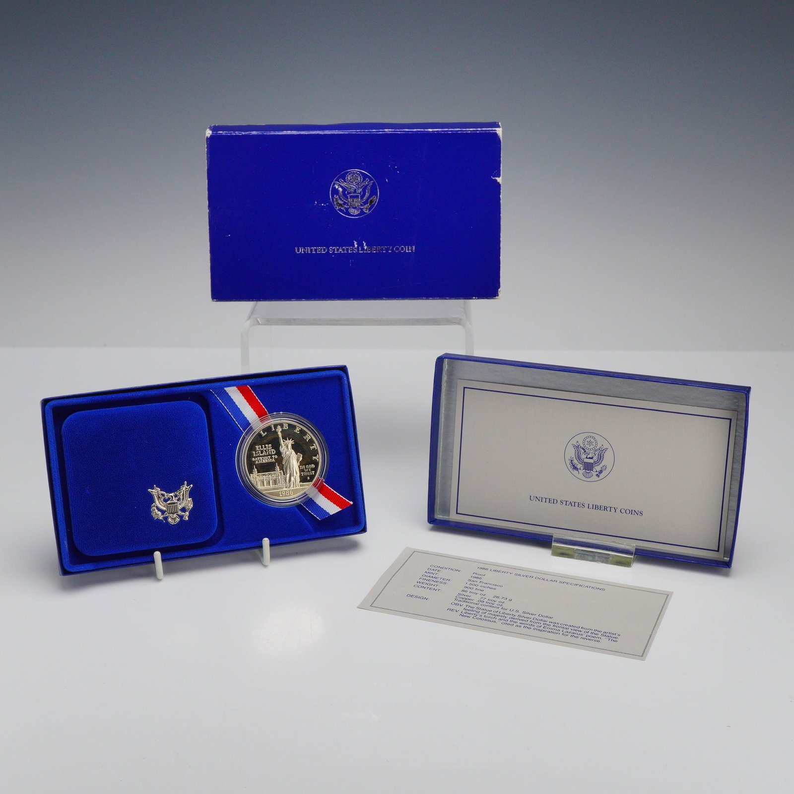 1986-S US Liberty Silver Dollar Proof Coin in OGP: This 1986-S US liberty silver coin is a commemorative silver dollar struck at the San Francisco Mint to celebrate the centennial of the Statue of Liberty. The coin features a proof finish