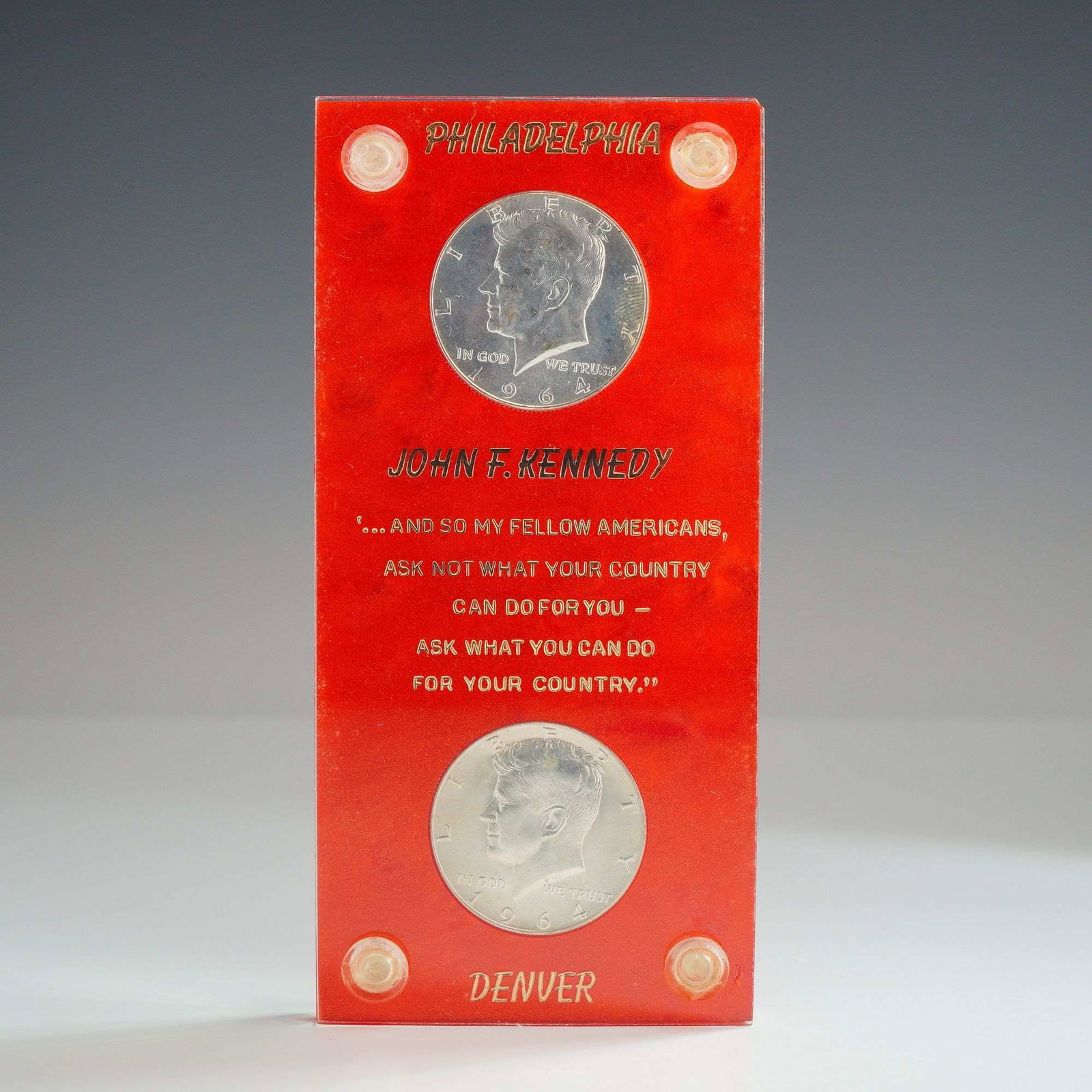 A Pair of US 1964 Kennedy Half Dollars: This lot consists of silver 1964 kennedy half dollars x 2, featuring one specimen from the Philadelphia Mint and one from the Denver Mint. Both coins are 90% silver Kennedy Half Dollar types. The coin