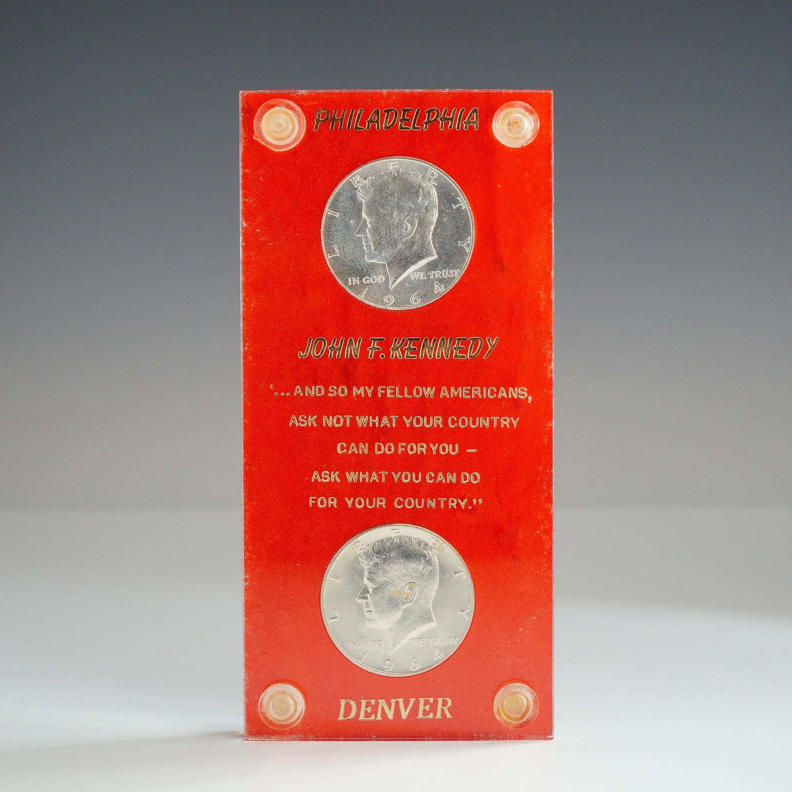 A Pair of US 1964 Silver Kennedy Half Dollars: A pair of US 1964 silver Kennedy half dollars consisting of one Philadelphia Mint specimen and one Denver Mint specimen. Both coins are struck in 90% silver. The obverse features the John F. Kennedy p