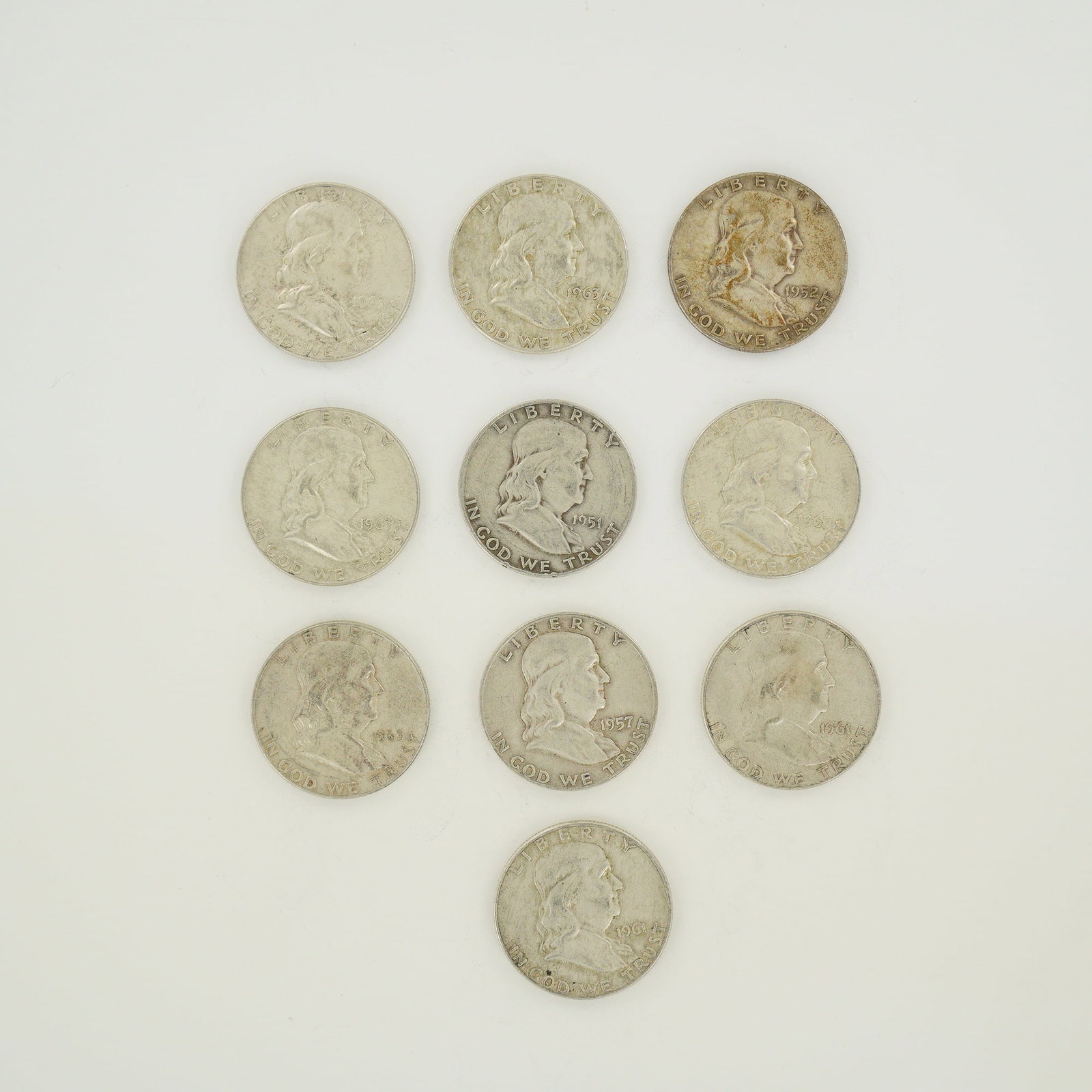 A Collection of US Ben Franklin 90% Silver Half Dollars: A collection of US Ben Franklin half dollars struck in 90% silver. This series features the Ben Franklin obverse and the Liberty Bell reverse. The group includes specimens with dates including 1951, 1