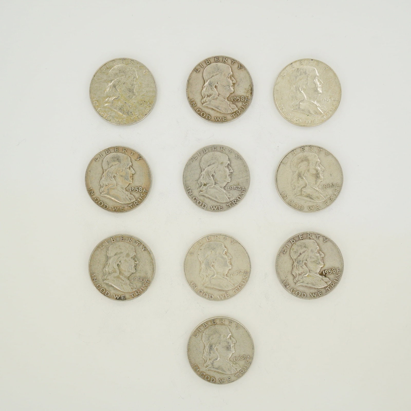 A Collection of US Ben Franklin Silver Half Dollars 1950-1963: A collection of US half dollars featuring the Ben Franklin obverse. Struck in a composition of 90 percent silver and 10 percent copper, these coins feature reeded edges. The group includes one 1950-D,