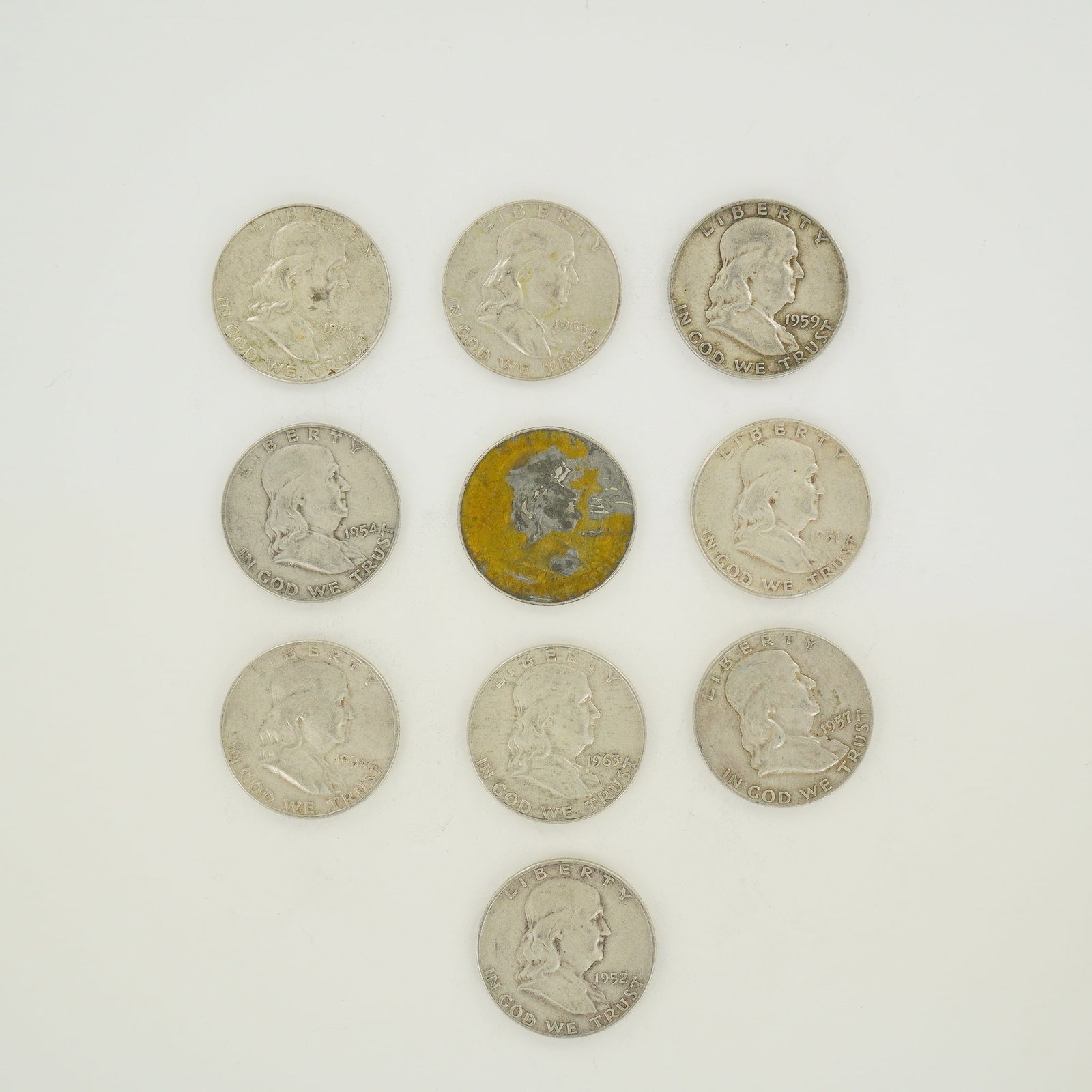 A Group of US Ben Franklin Half Dollars 90% Silver: A group of US Ben Franklin half dollars struck in 90% silver. This collection features the Ben Franklin obverse and the Liberty Bell reverse. Visible dates include 1951, 1952, 1954, 1957, 1959, and 19