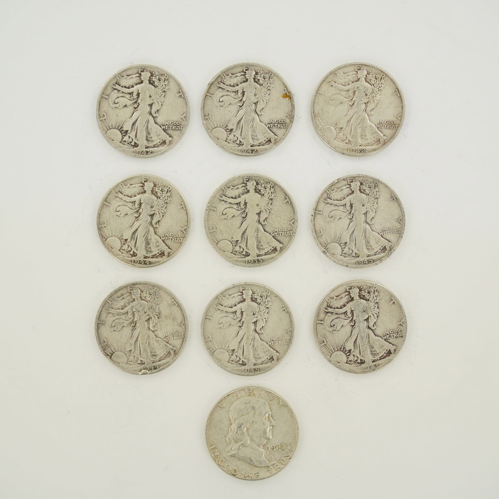 A Collection of 10 US Silver Half Dollars Including Walking Liberty and Franklin Types (1 of 2)