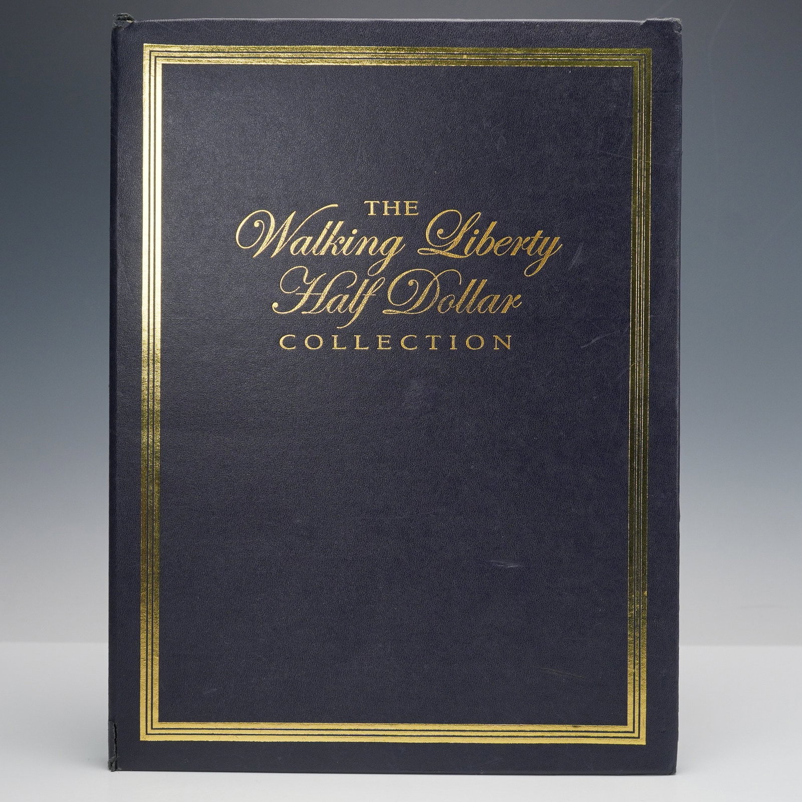 1934-1947 Walking Liberty Half Dollar Collection: Presented is a complete set of Walking Liberty half dollars covering the years 1934 through 1947. Each coin is mounted in a hardcover display album with blue felt interior, showing only the obverse