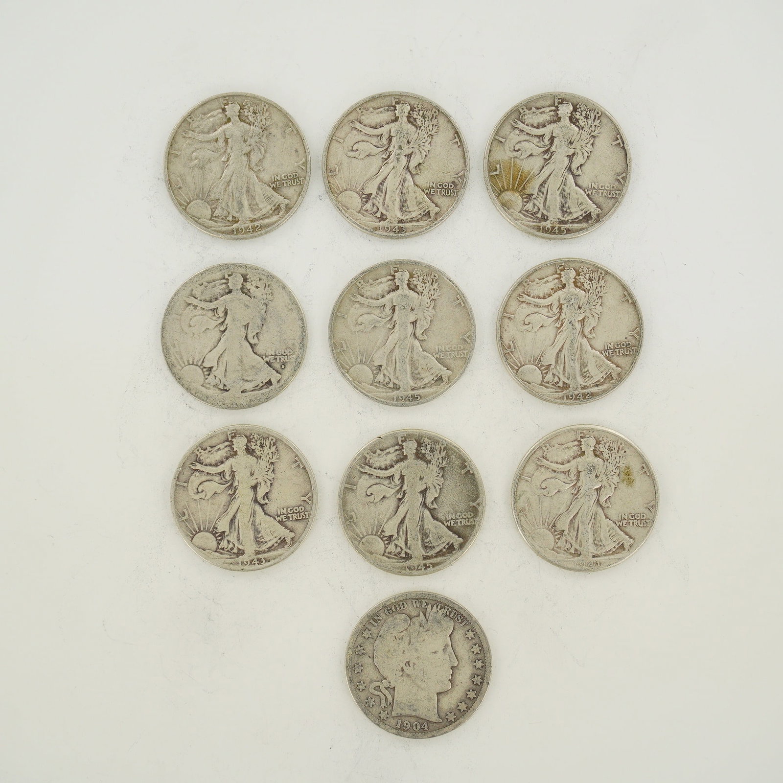 Mixed Date Bag of US 90% Silver Walking Liberty and Barber Half Dollars: This mixed date bag of US silver half dollars contains Walking Liberty and Barber types. The Walking Liberty coins feature the Walking Liberty obverse and include dates 1941, 1942, 1943, and 1945,