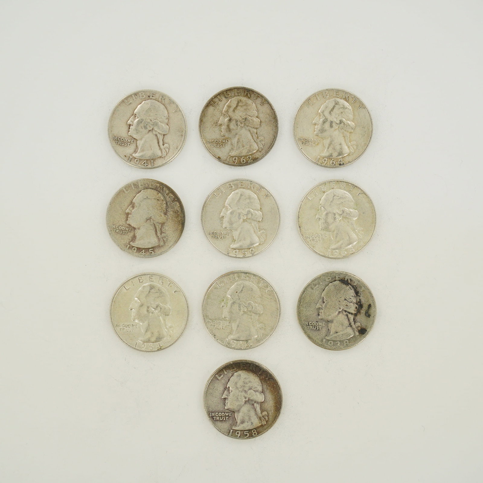 Ten US 90% Silver Washington Quarters Mixed Date Bag of 1938-1964: Ten US Washington quarters struck in 90% silver. This lot consists of a mixed date bag of coins issued between 1938 and 1964. The group includes the following date and mint mark combinations: 1938, 19