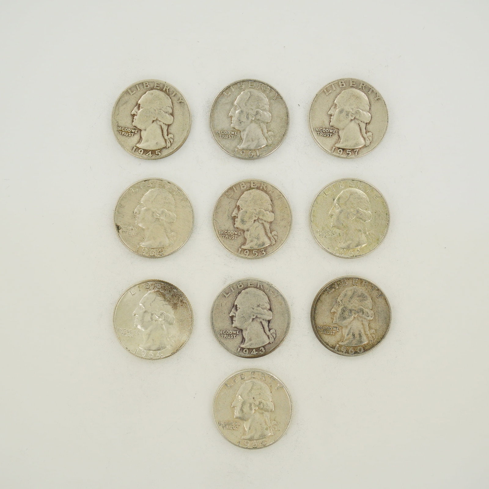 10pc Mixed Date Bag of US 90% Silver Washington Quarters, 1943-1964: This mixed date bag of US Washington quarters consists of a collection of 90% silver coinage struck between 1943 and 1964. The group includes 1943, 1945, 1953, 1957, 1960, 1961, 1962, and 1964 issues.