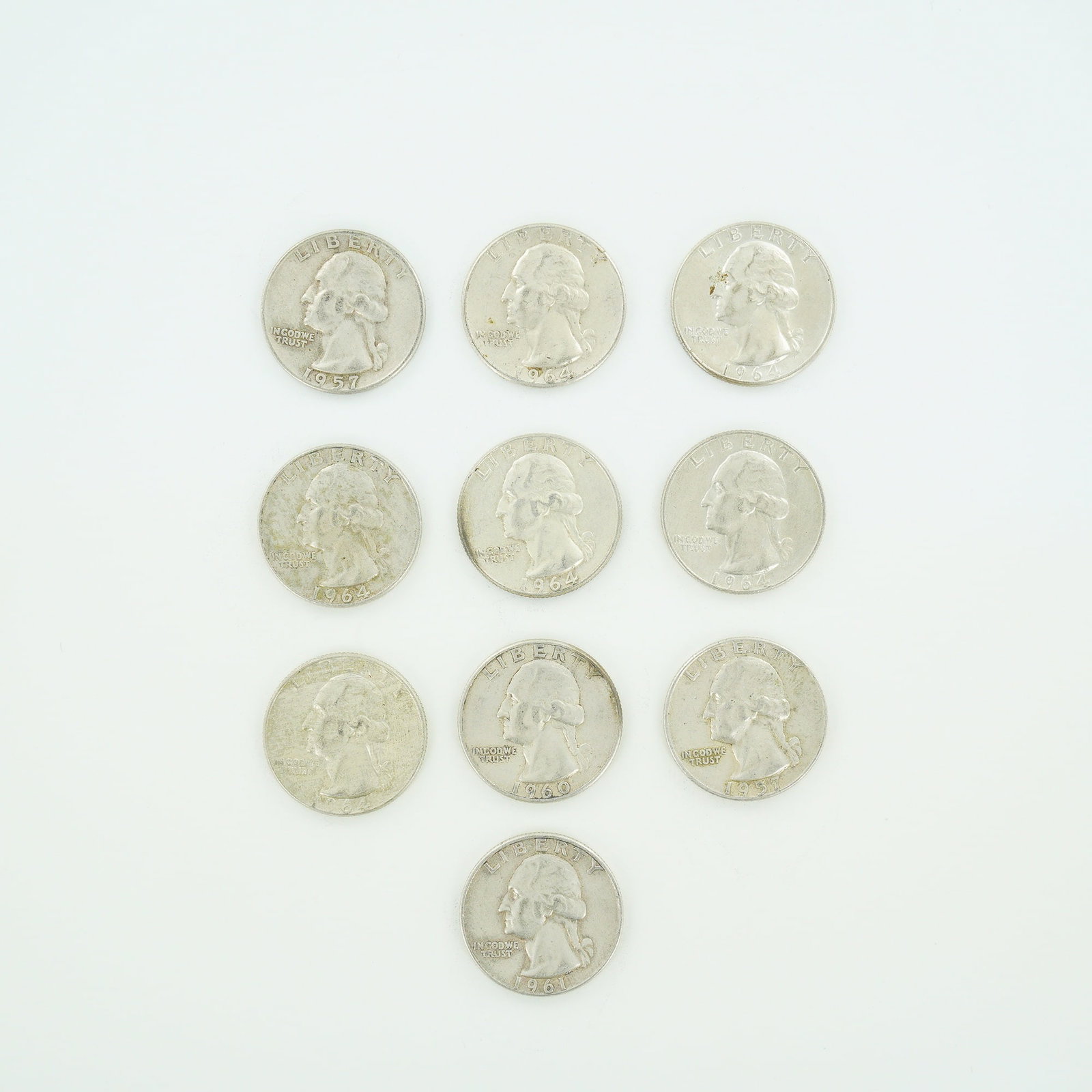 10pc Pre-1964 U.S. 90% Silver Washington Quarters: This lot consists of a mixed date bag of US Washington quarter dollars. The coins are silver-colored and feature the Washington Quarter reverse design. Visible mint marks include D and S located below