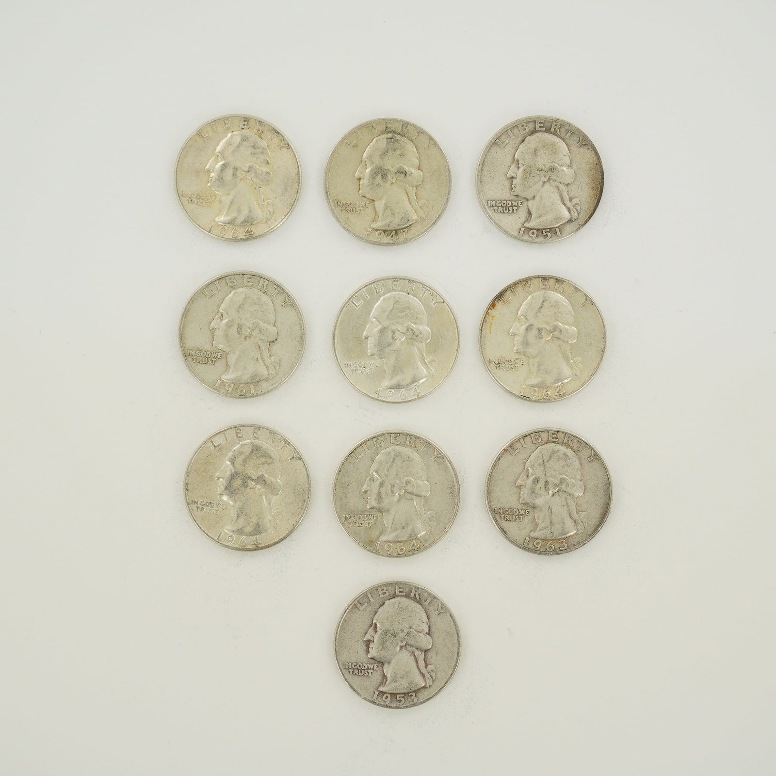 10pc Pre-1964 U.S. 90% Silver Washington Quarters: A collection of ten US Washington quarter dollars composed of 90 percent silver and 10 percent copper. This mixed date bag of coins includes one 1947-D, one 1951, one 1953-D, one 1961, one 1963-D, and