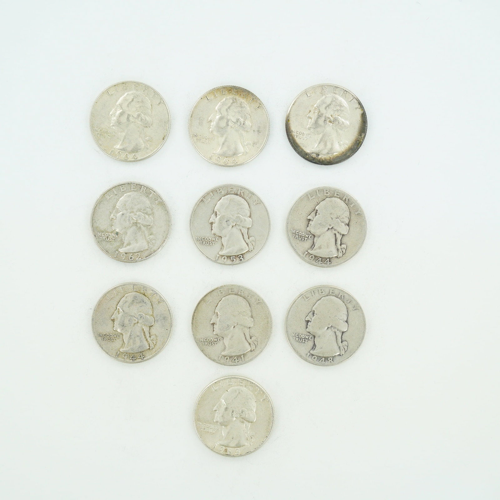 10pc Pre-1964 U.S. 90% Silver Washington Quarters: A collection of ten US Washington quarter dollars composed of 90% silver and 10% copper. This mixed date bag of coinage includes the following dates and mint marks: 1941-S, 1944-D, 1944, 1948, 1953-D,