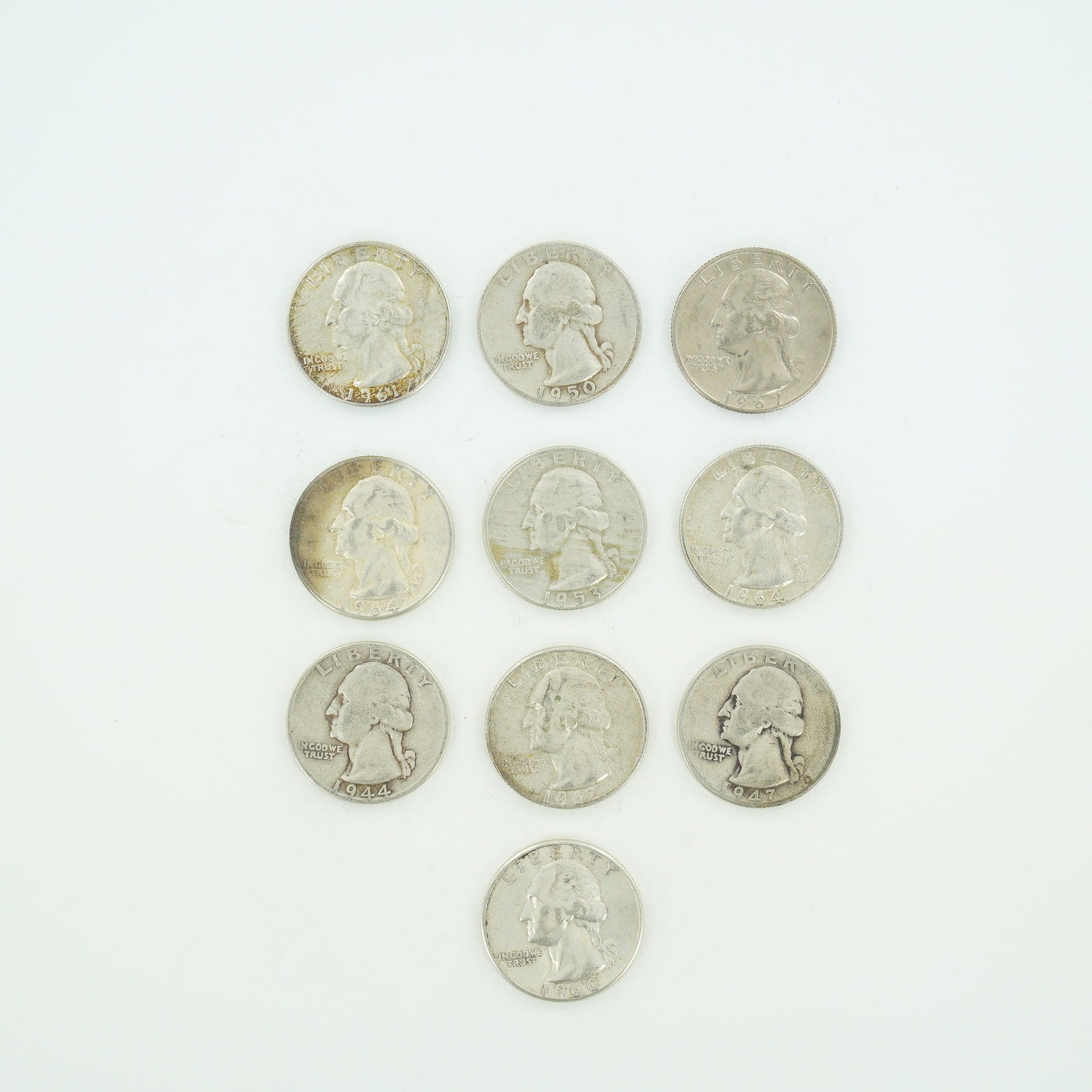 10pc Pre-1964 U.S. 90% Silver Washington Quarters: A Collection of Coins consisting of US Washington Quarters featuring a mixed date bag of specimens struck in 90% silver. The group includes issues from the Philadelphia and Denver Mints dating from 19