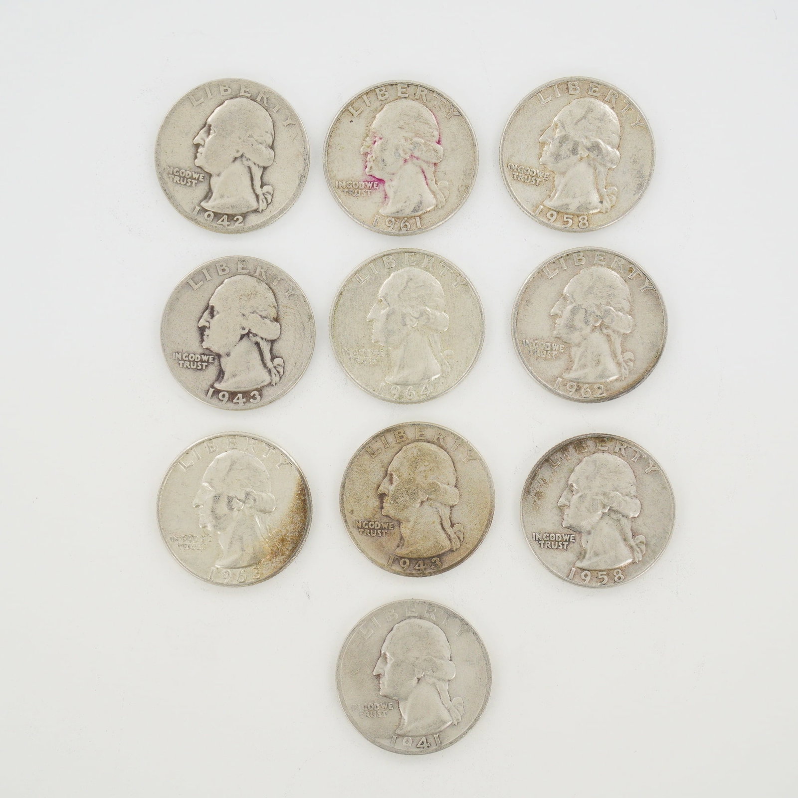 10pc Pre-1964 U.S. 90% Silver Washington Quarters: A collection of coins consisting of US Washington Quarters struck in 90% silver. This group is identified as a mixed date bag of silver coinage and includes various dates and mint marks including 1941