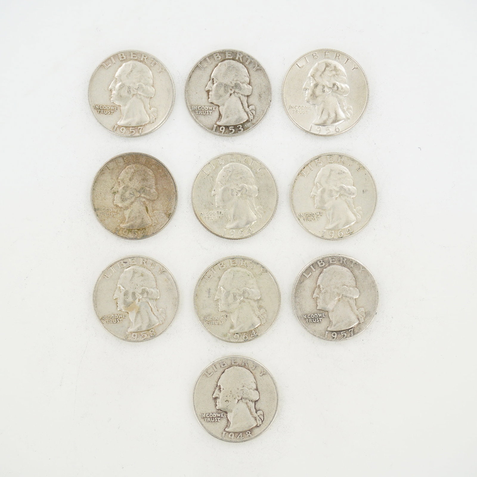 10pc Pre-1964 U.S. 90% Silver Washington Quarters: This lot consists of ten US Washington Quarter Dollars struck in 90% silver and 10% copper. The group represents a mixed date bag of circulated coinage with dates including 1948, 1953, 1954, 1956, 195
