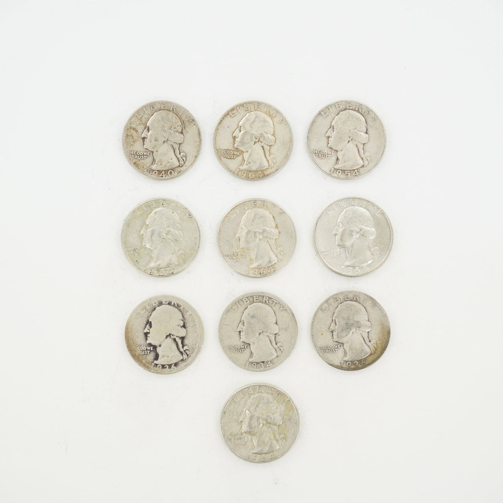 10pc Pre-1964 U.S. 90% Silver Washington Quarters: A collection of ten US Washington quarter dollars struck in 90 percent silver. The group includes one 1934, two 1936, one 1940, one 1954-S, and five 1964 coins, two of which are 1964-D. These coins ar