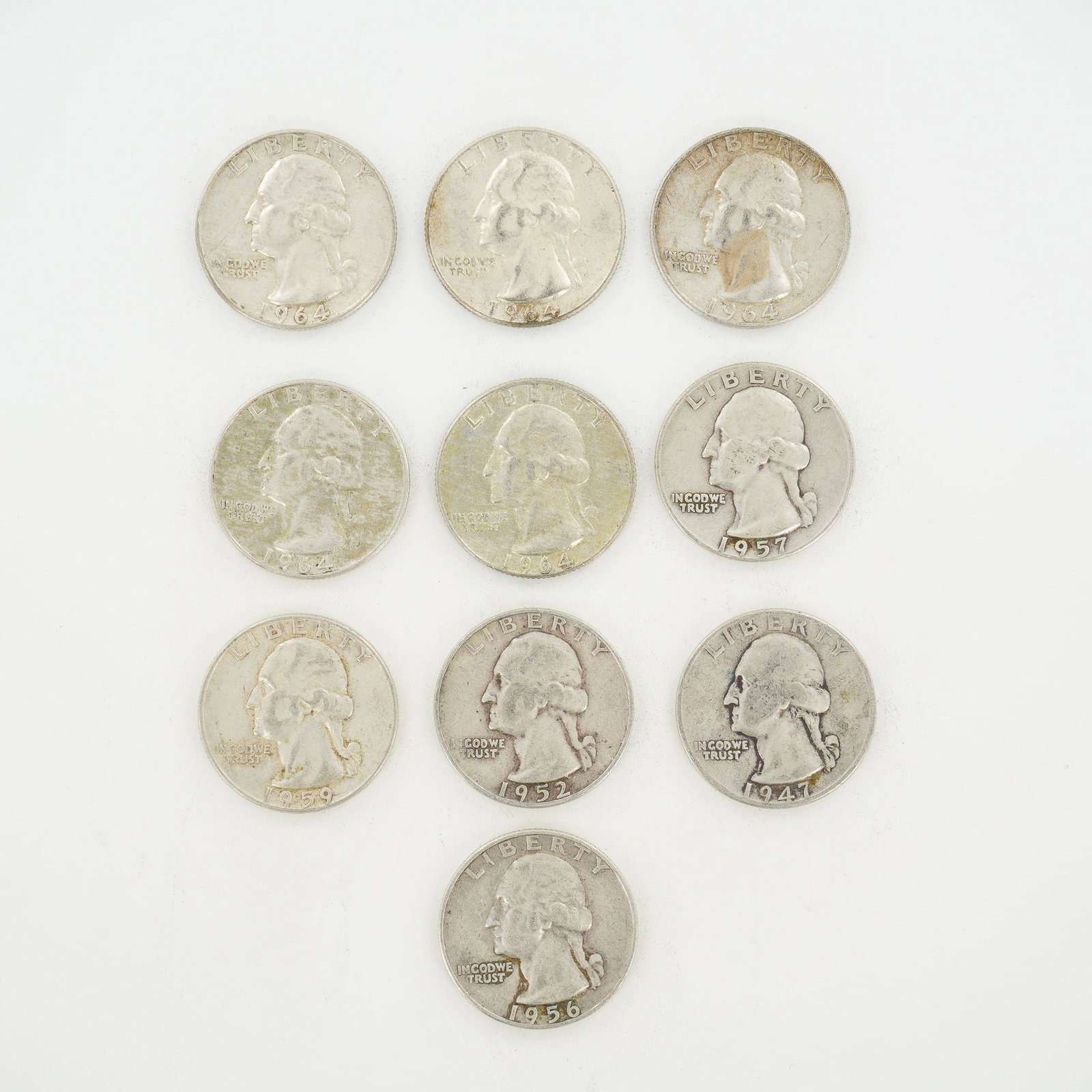 10pc Pre-1964 U.S. 90% Silver Washington Quarters: A collection of US 90% silver Washington Quarters featuring a mixed date bag of coins issued between 1947 and 1964. These specimens are struck in 90% silver (.900 fine). The group includes the Washing