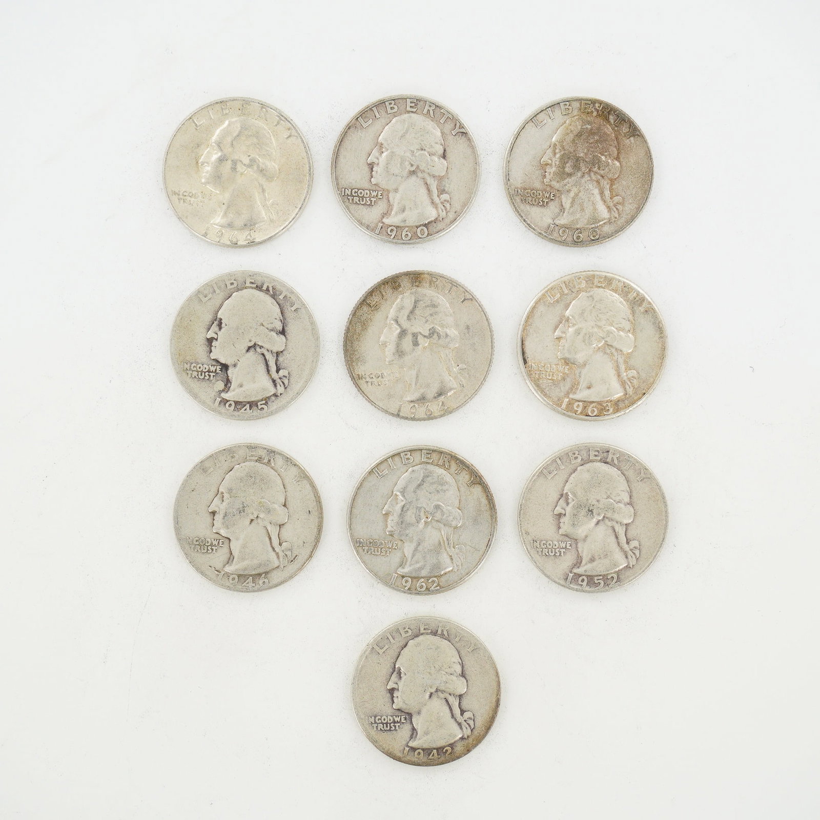 10pc Pre-1964 U.S. 90% Silver Washington Quarters: A collection of US 90% silver Washington quarters featuring mixed dates. This mixed date bag of coinage includes various issues dated between 1942 and 1964, corresponding to catalog reference KM# 164.