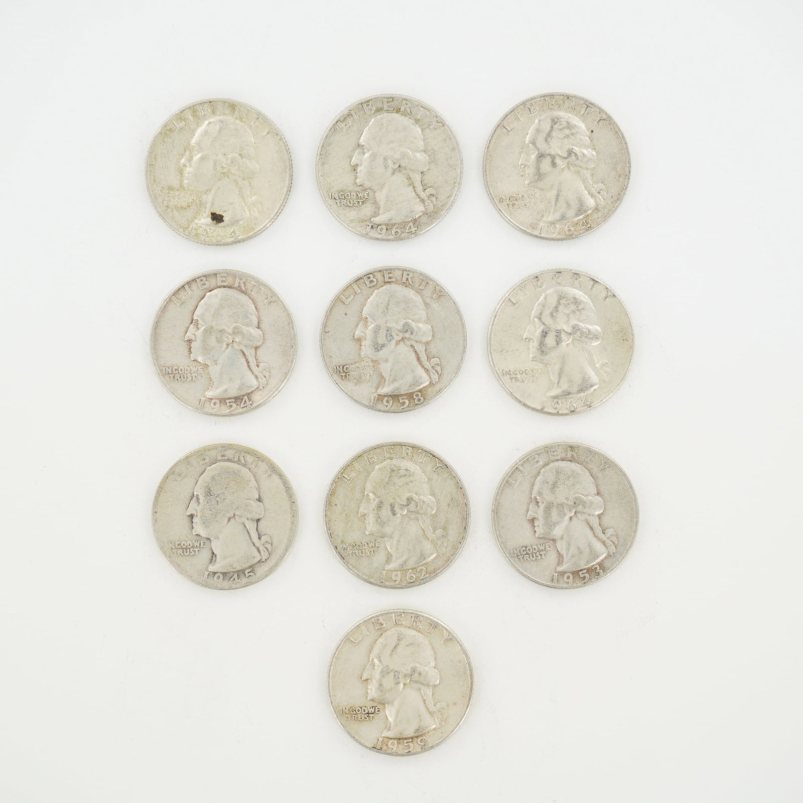 10pc Pre-1964 U.S. 90% Silver Washington Quarters: This mixed date bag of US Washington Quarter Dollars is struck in 90% silver with dates ranging from 1945 to 1964 (KM# 164). The group includes coins from the Philadelphia Mint dated 1964, Denver Mint