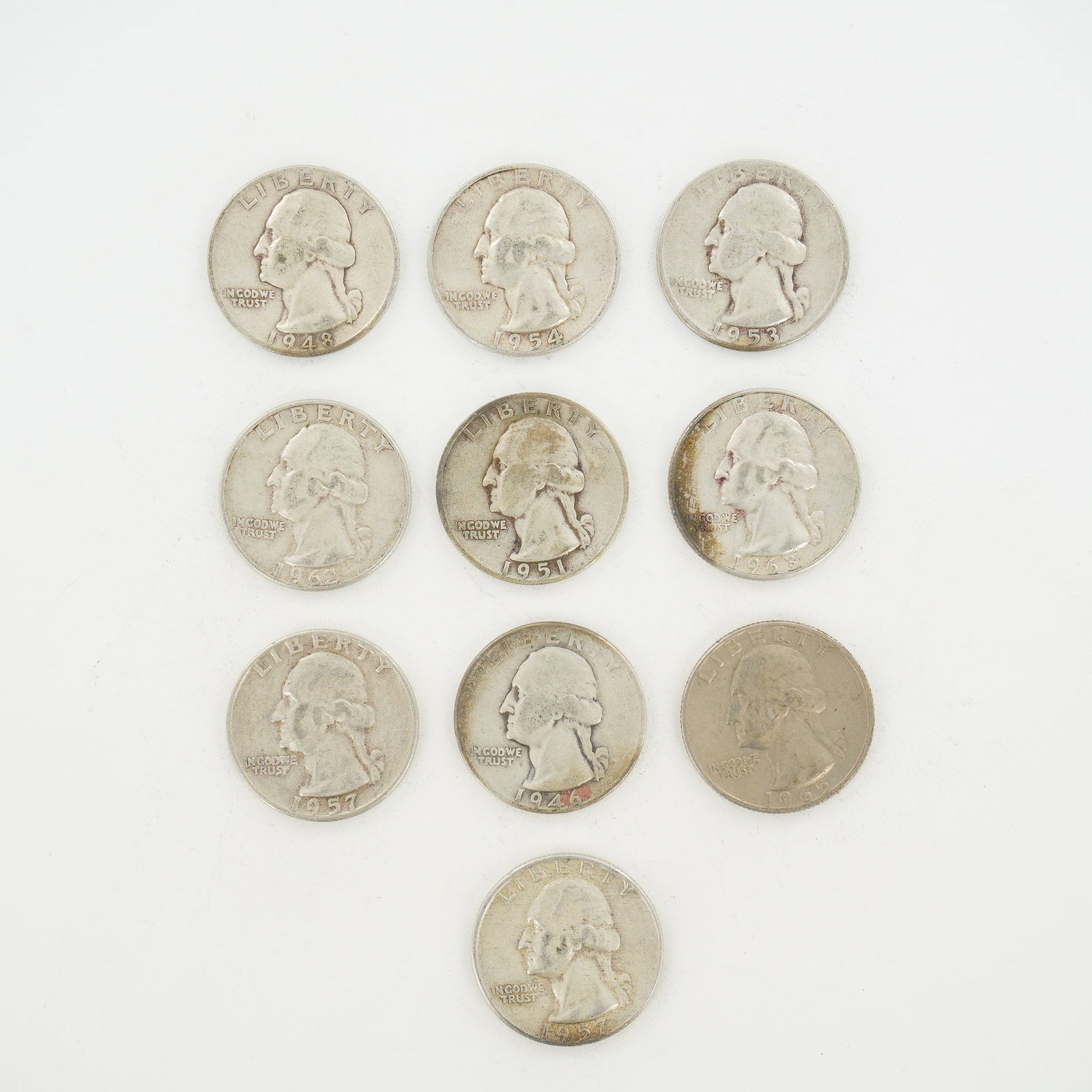 10pc Pre-1964 U.S. 90% Silver Washington Quarters: This collection of 10 US Washington Quarter Dollars includes nine 90 percent silver issues and one copper-nickel clad issue. The silver coins comprise the following dates and mint marks: 1946 (Philade