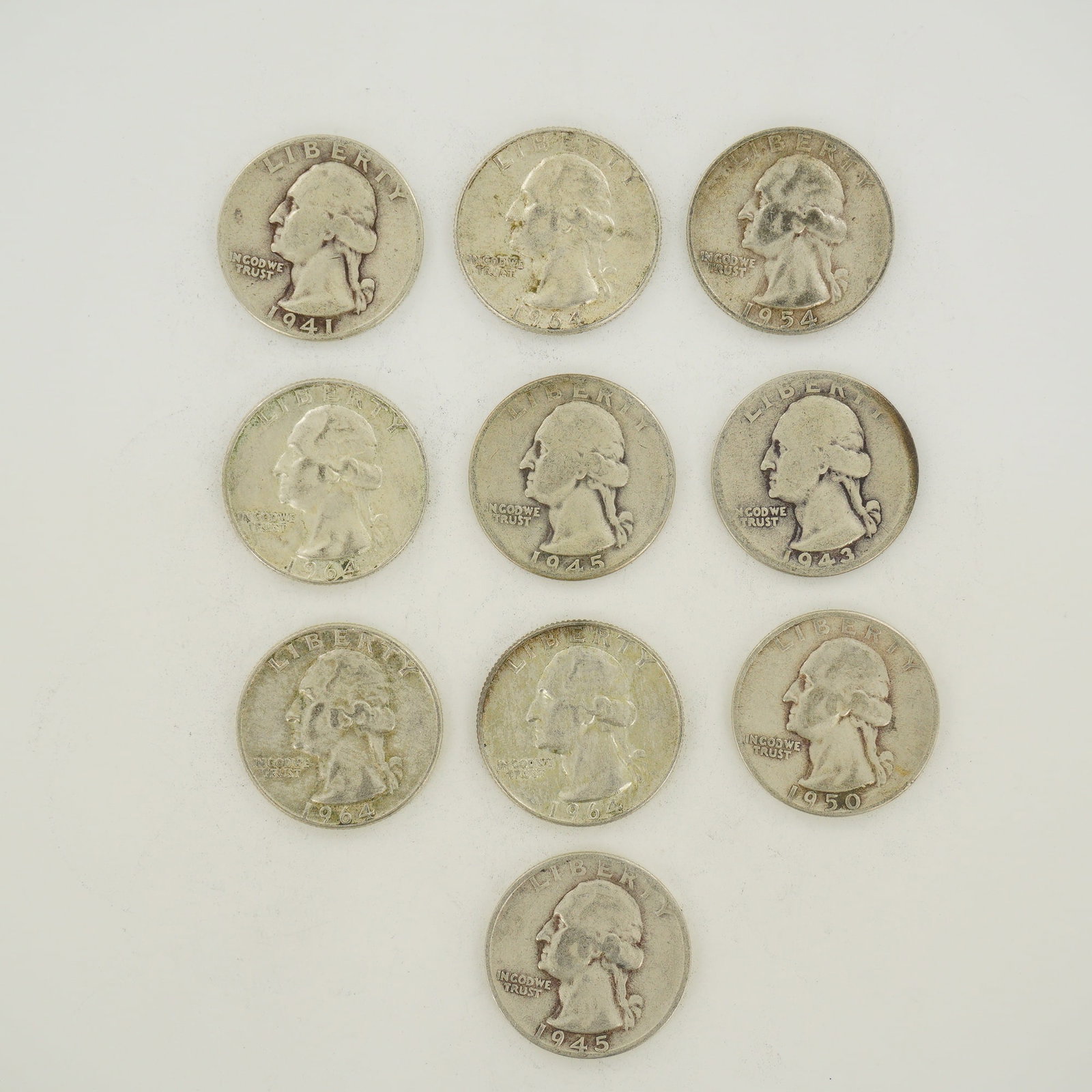 10pc Pre-1964 U.S. 90% Silver Washington Quarters: A collection of US Washington quarters composed of 90% silver and 10% copper. The assortment includes coins with dates 1941, 1943, 1945, 1950, 1954, and 1964. Mint marks are present on the reverse, in