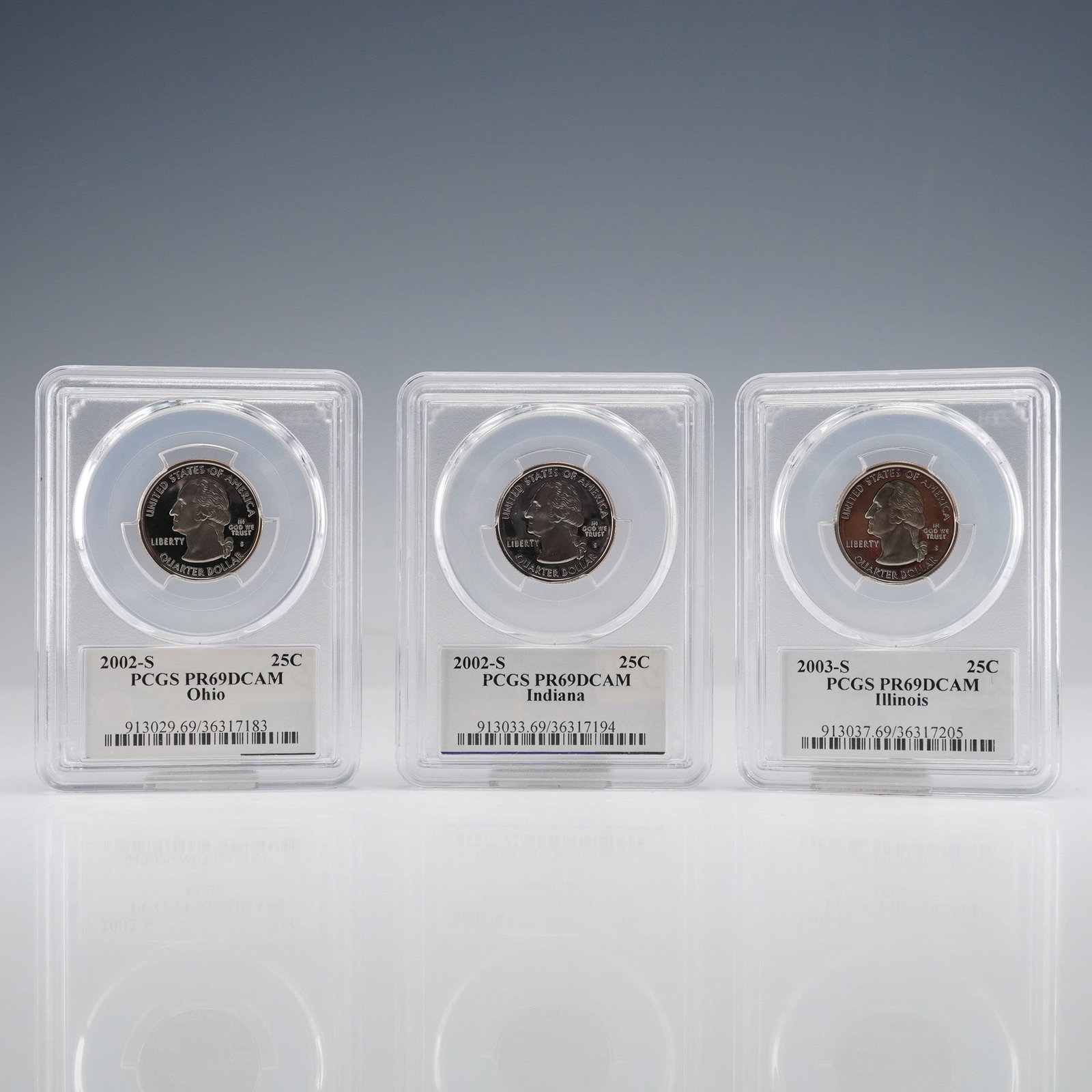 3pc US 2002-S, 2003-S 25C State Quarters, Clad Proof, PCGS PR69DCAM: A trio of three US 50 State Quarters, all Proof issues struck at the San Francisco Mint (S mint mark). This lot includes the 2002-S Ohio Quarter, the 2002-S Indiana Quarter, and the 2003-S Illinois Qu