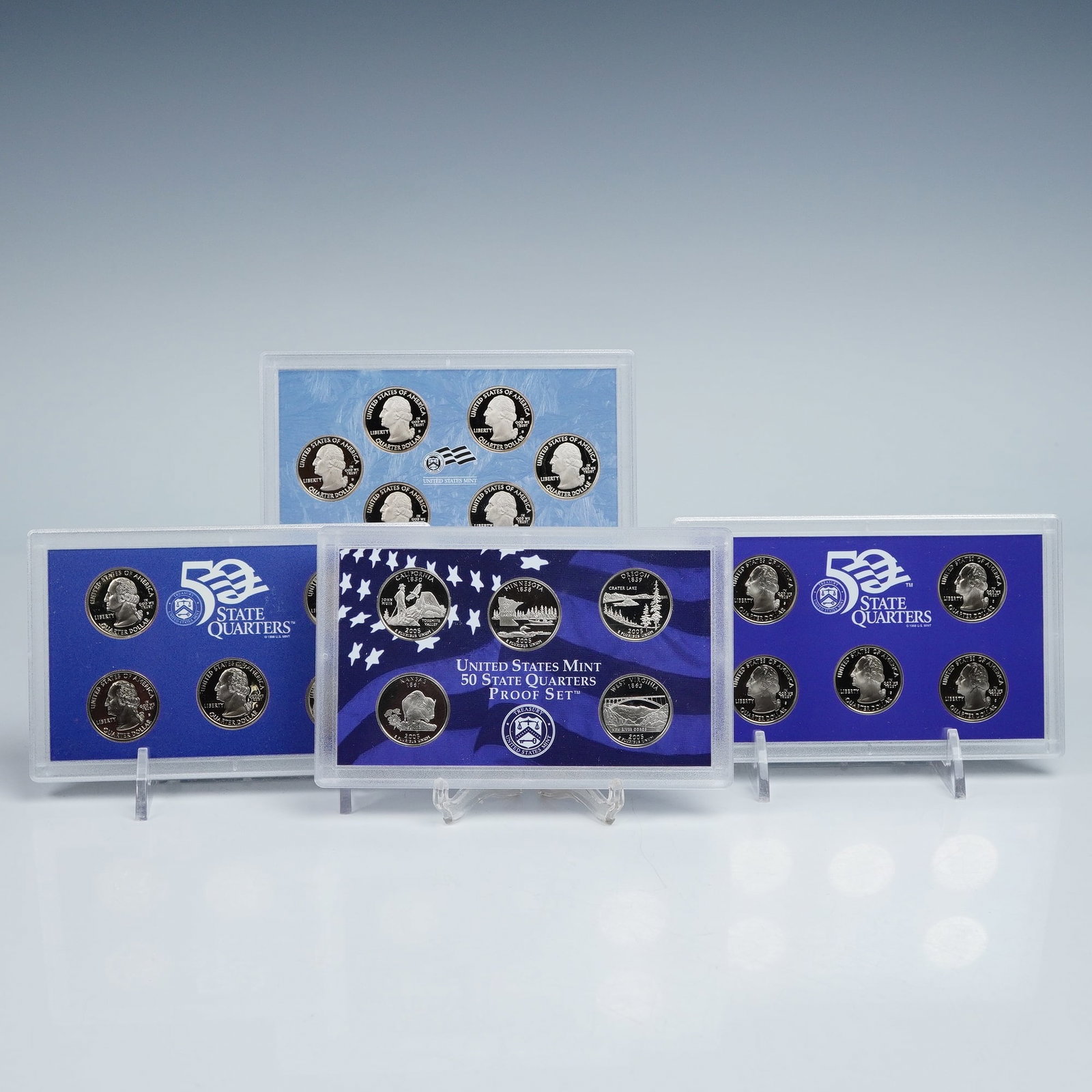 4pc 1999-2009 United States Mint 50 State Quarters Proof Sets: Four United States Mint 50 State Quarters Proof Sets, each housed in its original presentation case with matching outer box and certificate of authenticity. Each set contains five or six proof coins r