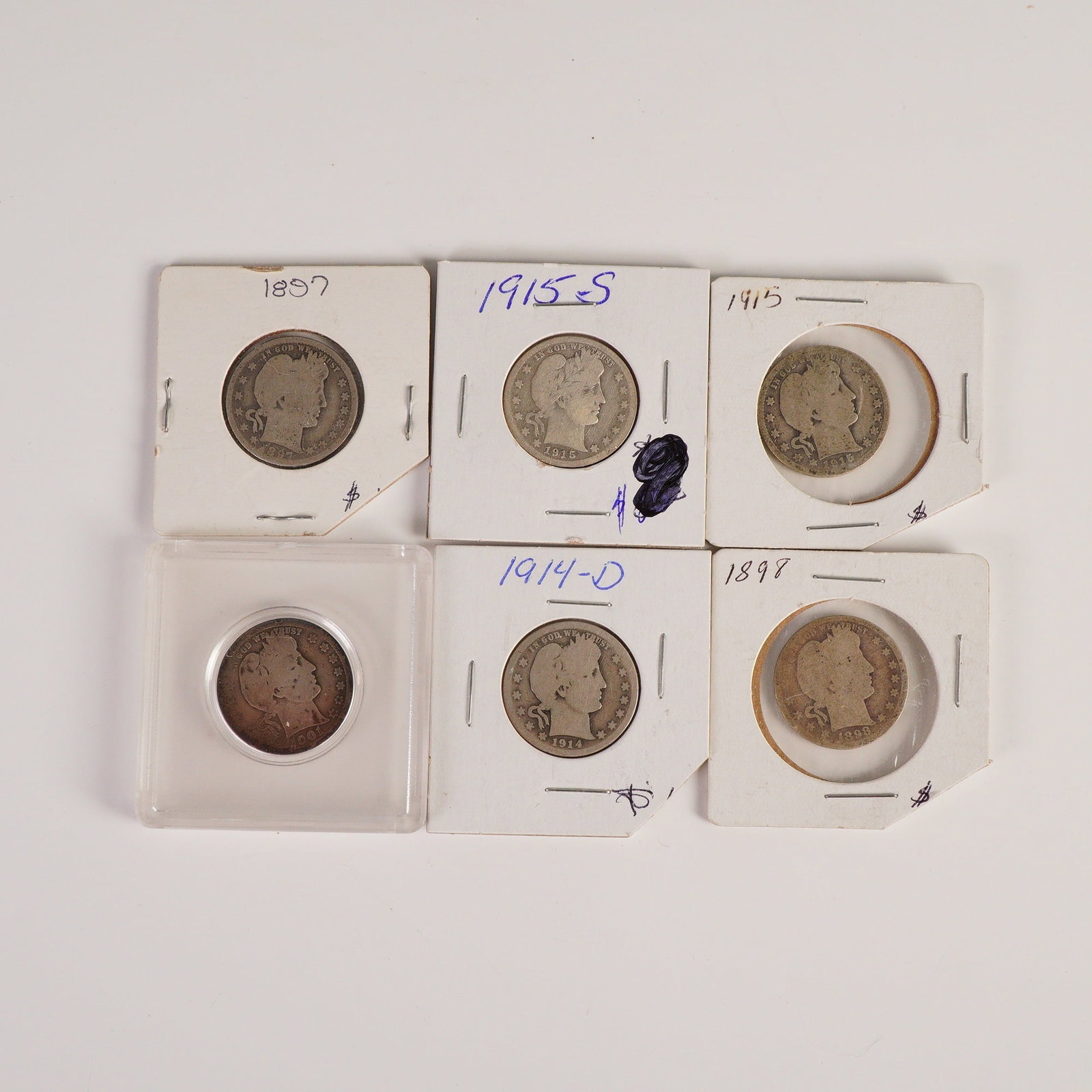 6pc 1897-1915 Barber Quarter Dollar: Includes coins dated 1897, 1898, 1901, 1914-D, 1915, and 1915-S. The obverse depicts the bust of Liberty facing right, encircled with IN GOD WE TRUST above, thirteen starts, and the year below. The re