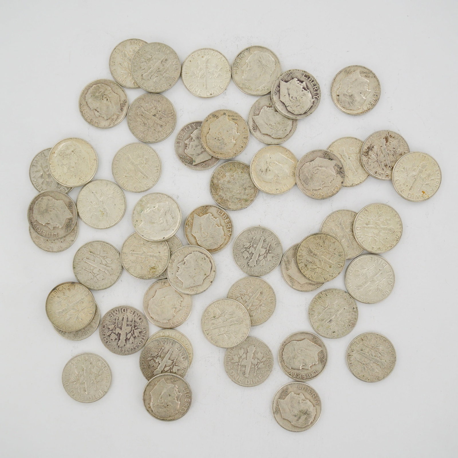 A Collection of US 90% Silver Roosevelt Dimes, Mixed Date Bag: This collection of US Roosevelt dimes consists of a mixed date bag of specimens struck in 90% silver and 10% copper. The group includes various dates minted between 1953 and 1964, including 1953, 1954