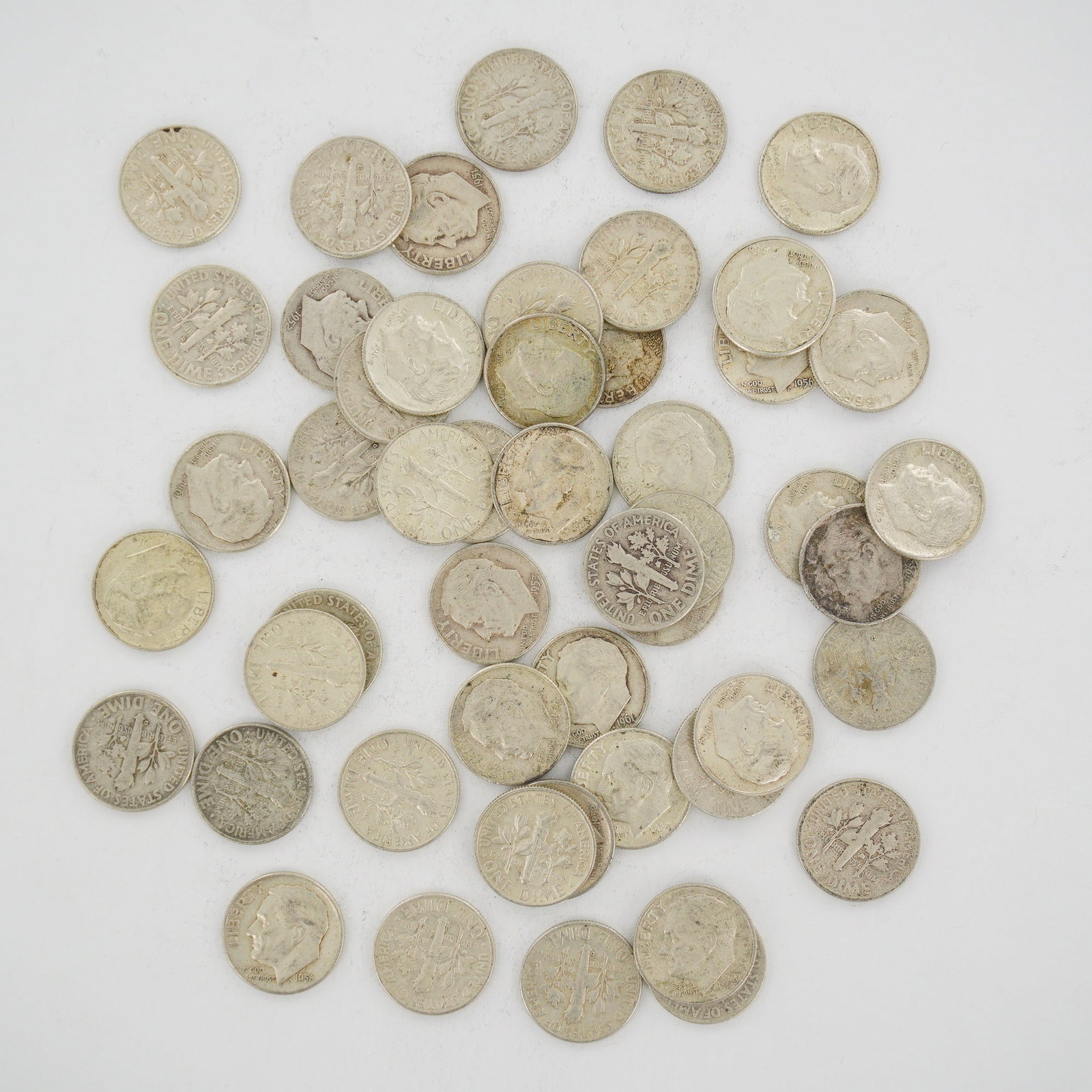 A Collection of US 90% Silver Roosevelt Dimes, Mixed Date Bag: This assortment consists of a mixed date bag of US Roosevelt Dimes, cataloged as KM 195. The coins are struck in 90% silver bullion and feature the Roosevelt obverse and the torch reverse. Visible ins