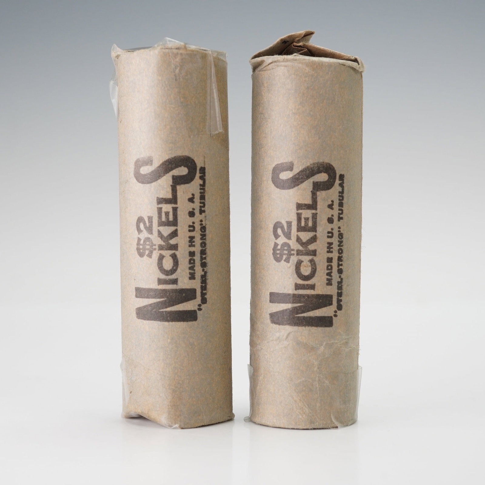 2pc United States Buffalo Nickels Coin Rolls: A pair of two coin rolls with buffalo nickels which features the right facing profile of a Native American on the obverse, a design blending the likenesses of Iron Tail and Two Moons. The reverse