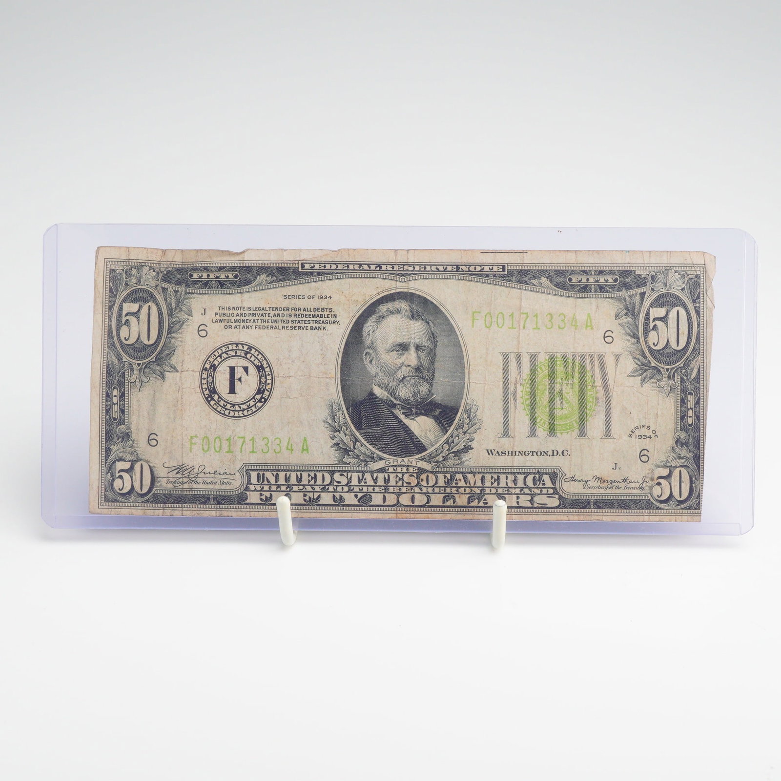 US Series of 1934 $50 Federal Reserve Note Atlanta District 6 Vintage Currency Bill: This vintage US currency bill $ 50.006 is a small-size Federal Reserve Note from the Series of 1934. Issued for the Federal Reserve Bank of Atlanta, Georgia (District 6), the note features the light