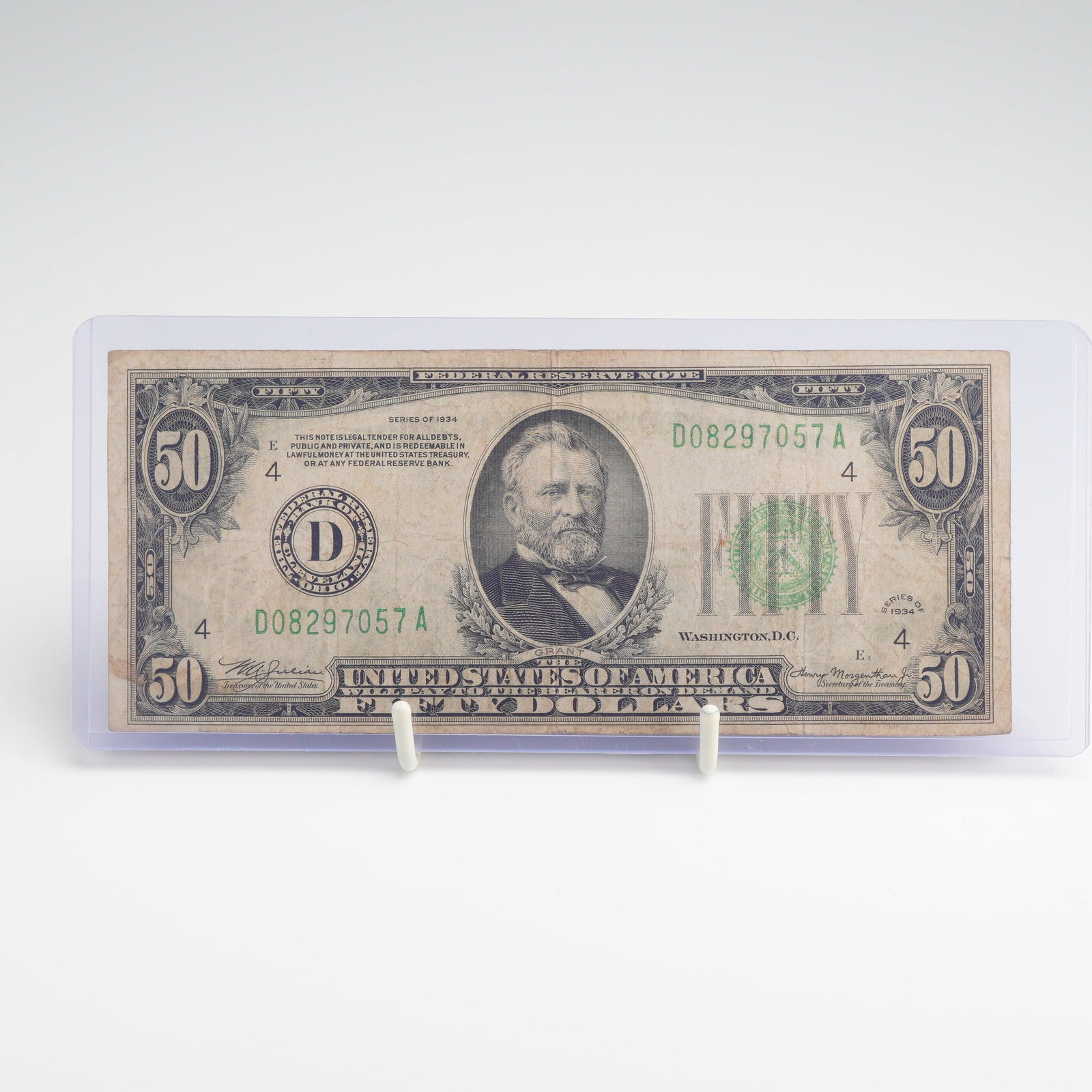 US Series of 1934 $50 Federal Reserve Note Cleveland District D: This vintage US currency bill $ 50.00 is a Series of 1934 Federal Reserve Note issued for the Federal Reserve Bank of Cleveland, Ohio. The obverse features a central portrait of Ulysses S. Grant with 