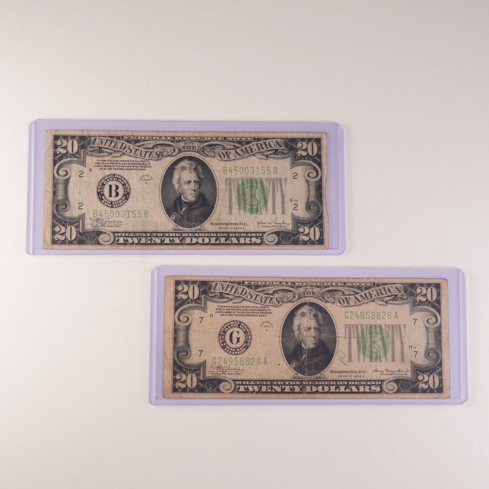 2pc 1934 A (Mule Note),C U.S. Federal Reserve Twenty Dollar Notes: Two U.S. Federal Reserve $20 notes, series 1934A and 1934C. Both feature the portrait of President Andrew Jackson at center and the green Treasury seal to the right. The reverse displays an engraving