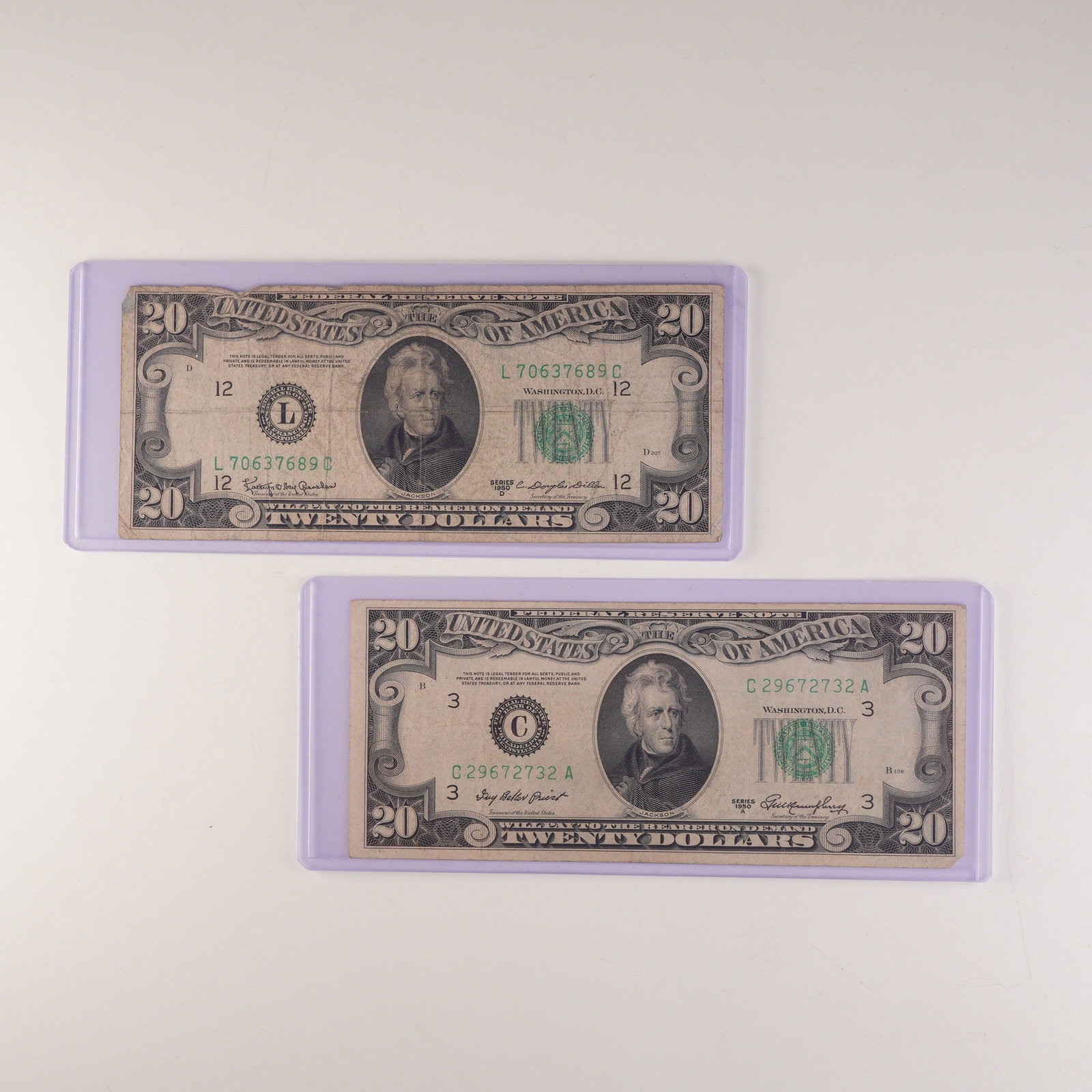 2pc 1950 A, D U.S. Federal Reserve Twenty Dollar Notes: U.S. Federal Reserve $20 notes, series 1950A and 1950D. Each note features a portrait of President Andrew Jackson at center with the green Treasury seal and serial numbers at right. The reverse