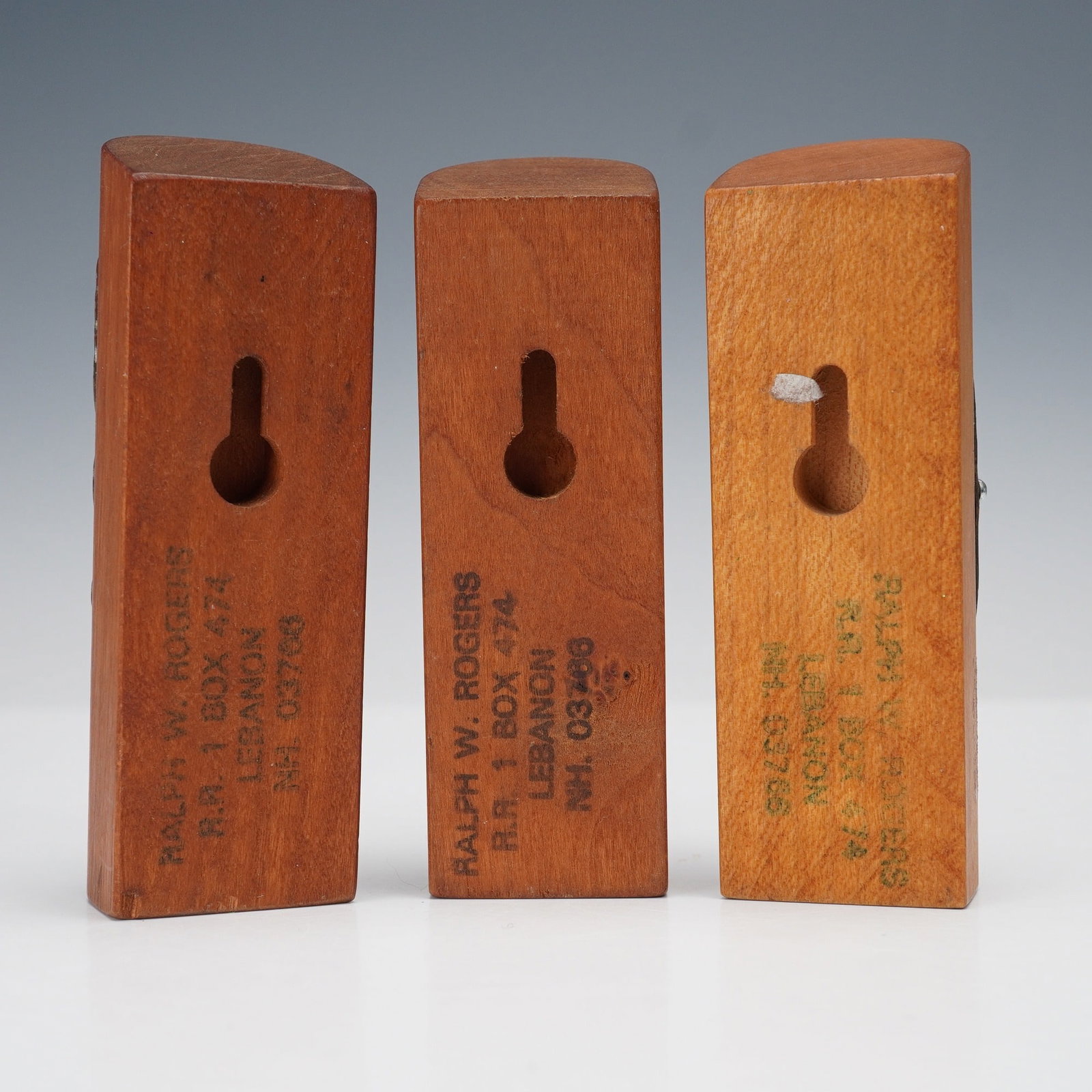 3pc Ralph W. Rogers Wooden Bicycle Head Badge Displays: A group of three vintage bicycle head badge displays mounted on custom wooden blocks by Ralph W. Rogers of Lebanon, New Hampshire. This lot includes examples from Centurion, Hawthorne (Hercules Cycle