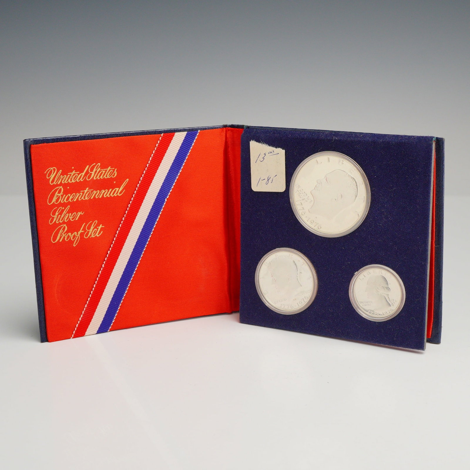 US 1776-1976 Bicentennial Silver Proof Set: Three US 1776-1976 Bicentennial silver proof coins struck at the San Francisco Mint. This usa bicentennial silver proof set includes an Eisenhower dollar, a Kennedy half dollar, and a Washington