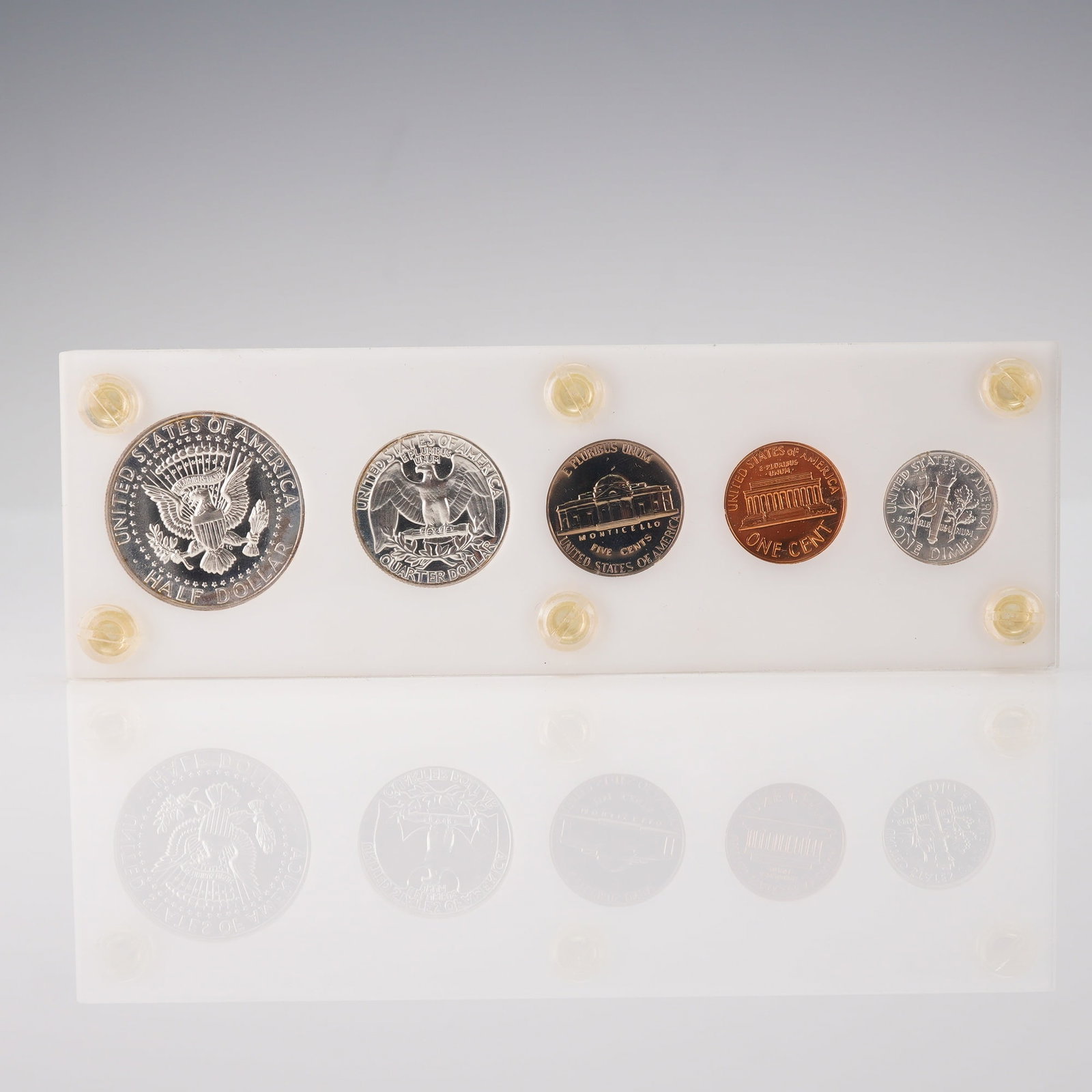 US 1964 Proof Set, 5-Coin Collection: A collection of five US Mint Proof coins dated 1964, housed in the original flat plastic presentation holder. This 1964 US Proof Coin set includes the Half Dollar (Kennedy reverse), Quarter Dollar