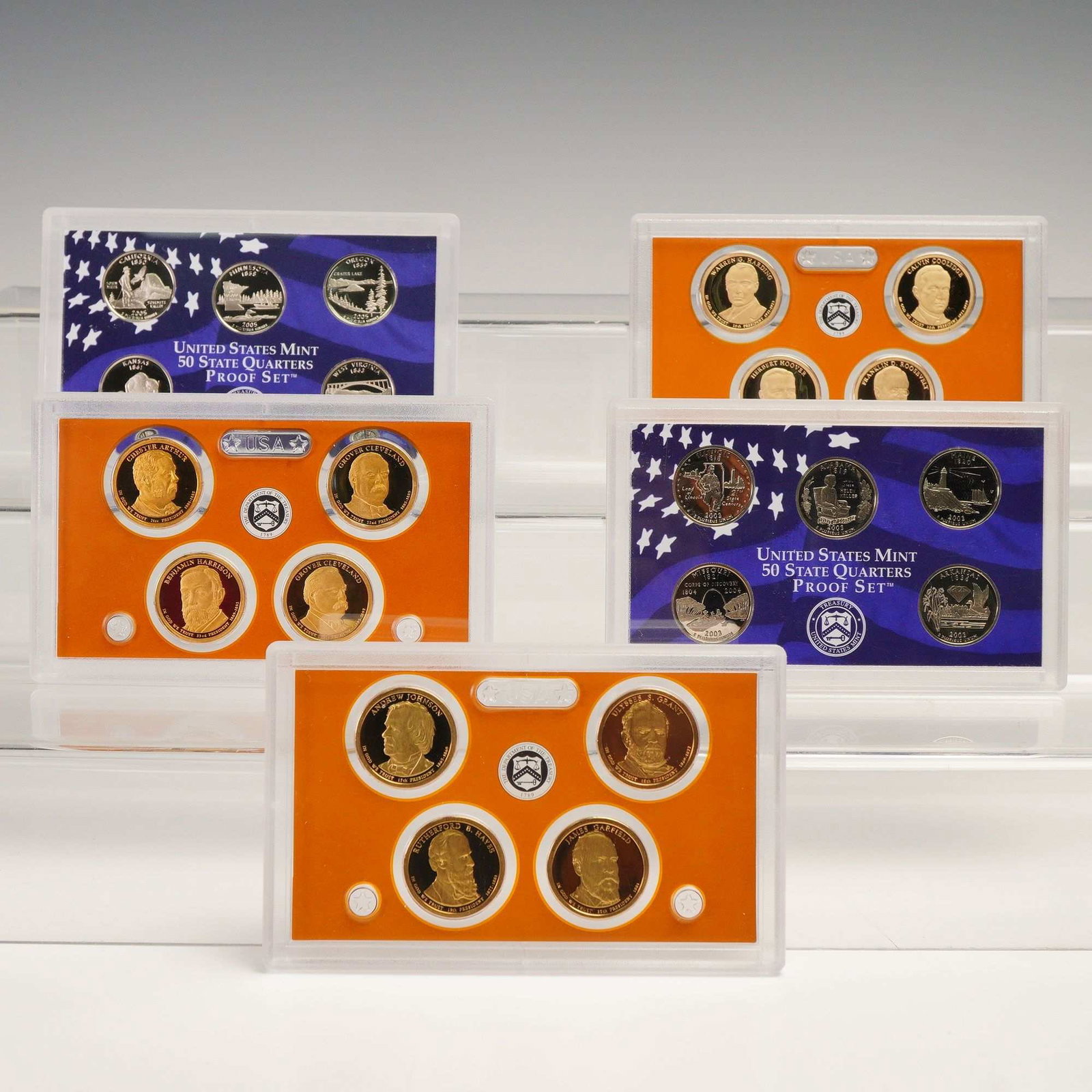 5pc 2003, 2005, 2011, 2012 & 2014 50 State Qtrs & $1 Presidential Proof Set: Lot includes a United States Mint 50 State Quarters Commemorative Proof Set together with a Presidential $1 Coin Proof Set, each presented in original Mint-issued hard plastic display cases. The 50 St