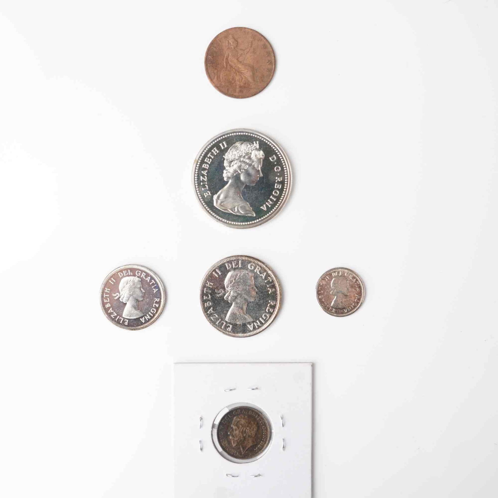 6pc 1892-1971 Canada and Great Britain Silver and Copper Coins: An appealing six piece assortment of Canada and Great Britain coins dating from 1892 to 1971. Included is an 1892 United Kingdom Half Penny bearing the second portrait of Queen Victoria, with Britanni