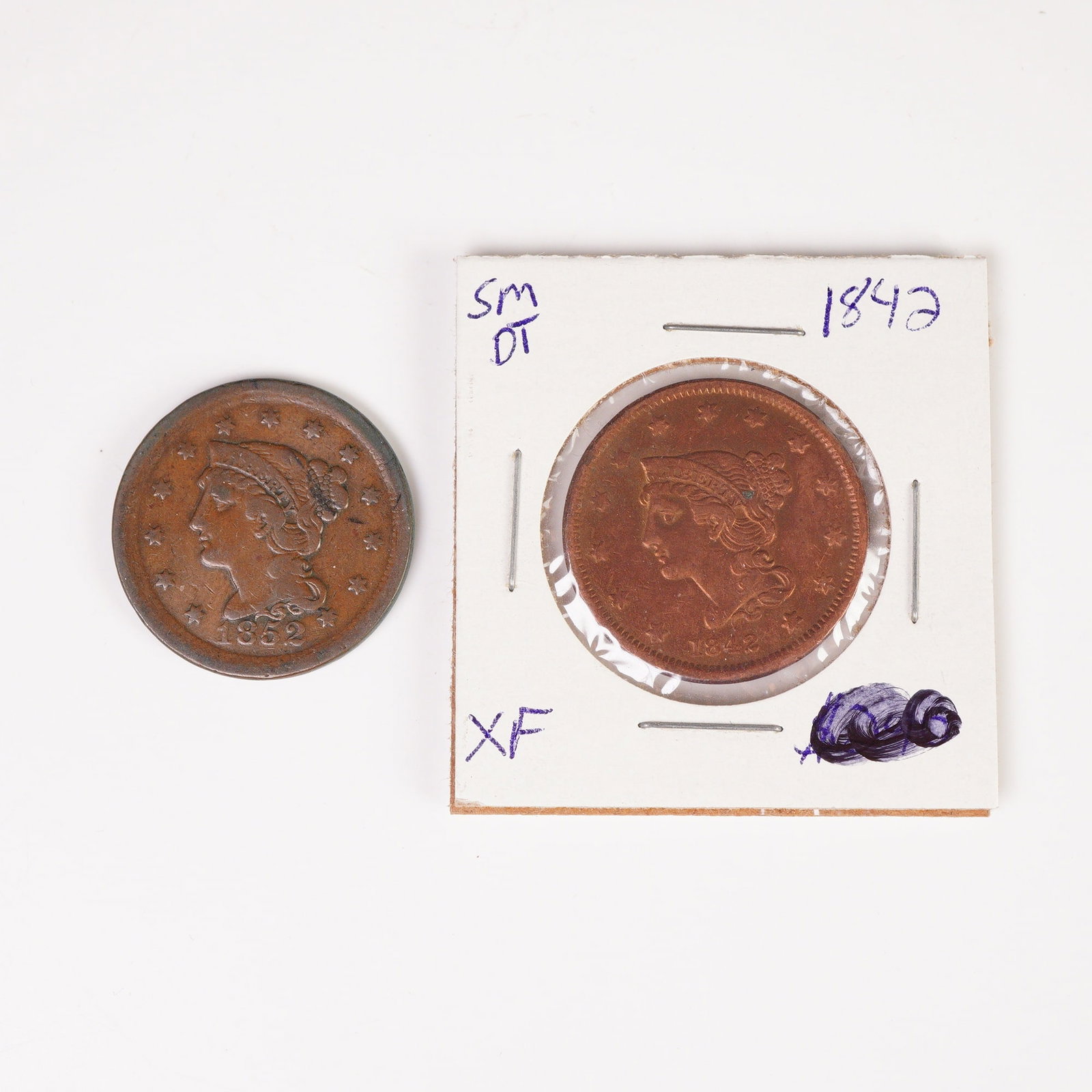 2pc 1842 to 1852 Braided Hair Liberty 1 Cent Coins: Each coin is struck in copper with a ONE CENT denomination, featuring on the obverse a left-facing portrait of Liberty surrounded by stars and the inscription LIBERTY, and on the reverse a laurel