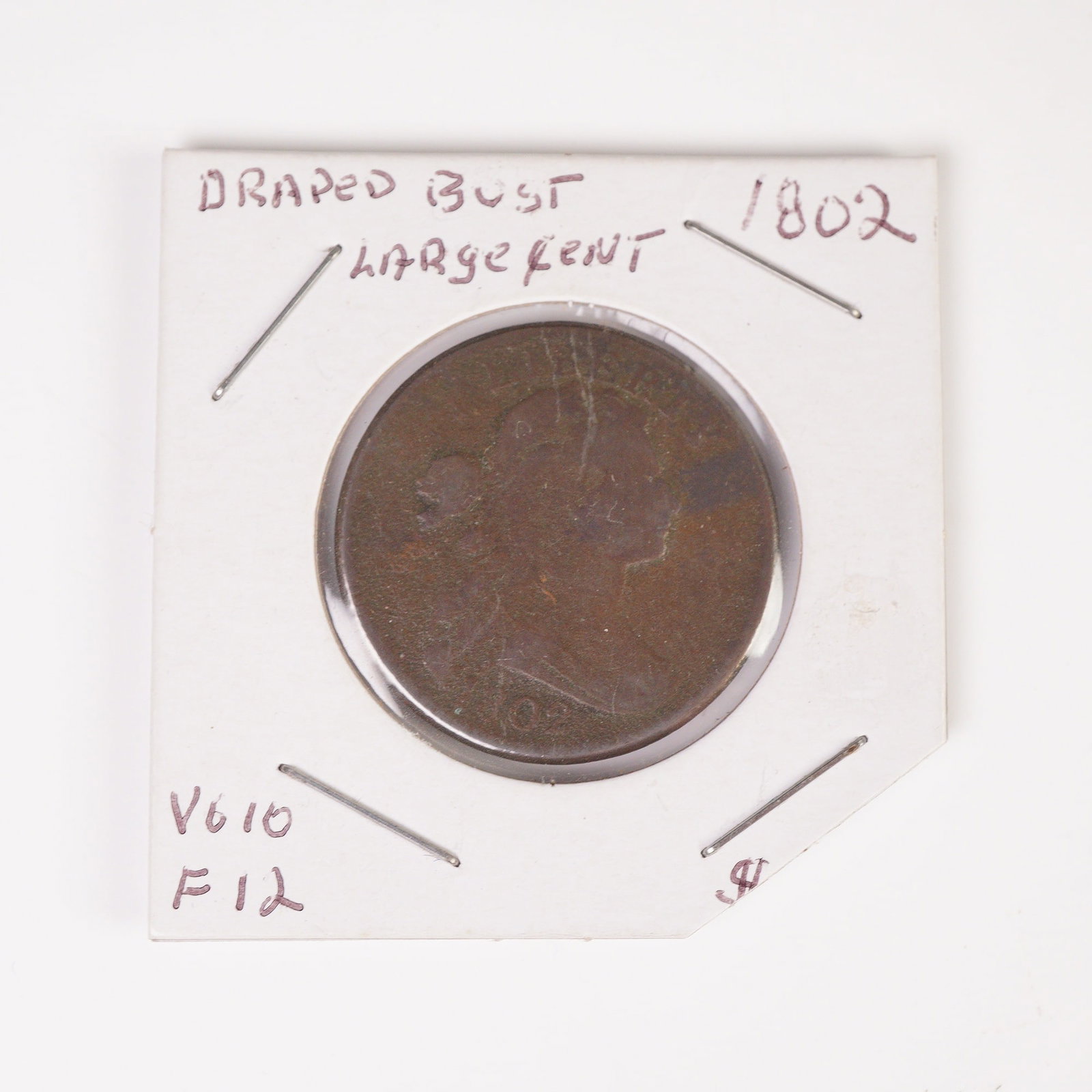 1802 Draped Bust 1 Cent Coin: Composed of a copper planchet typical of early U.S. cents. The obverse depicts a right-facing bust of Liberty surrounded by the inscription LIBERTY and the date below, while the reverse features a