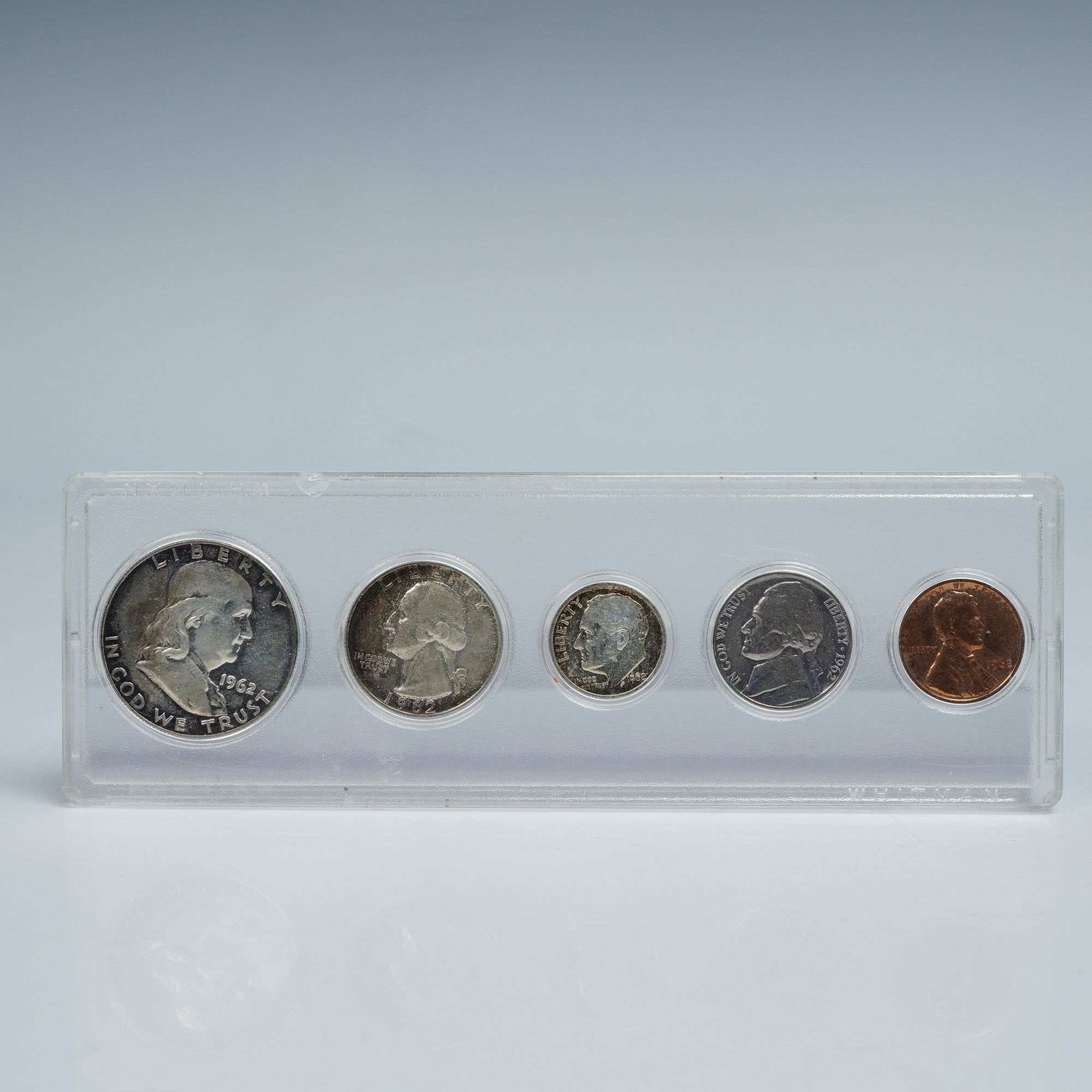1962 Set of 5 Coins: Includes: one Franklin Half Dollar (90% silver, 12.5 g), featuring Benjamin Franklin on the obverse with inscriptions LIBERTY and IN GOD WE TRUST, and the Liberty Bell with UNITED STATES OF AMERICA
