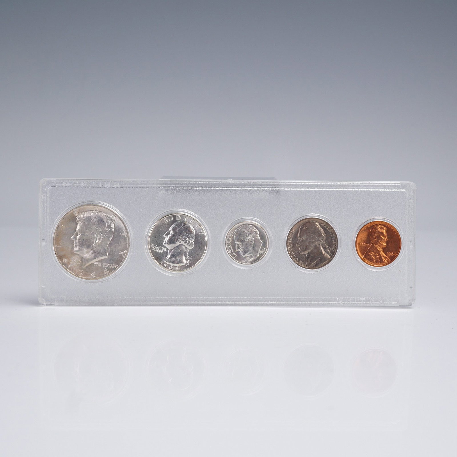 1964 United States 5 Coin Set: 1964 United States 5-coin set presented in a clear protective display holder. This final year of the 90% silver composition includes the Kennedy Half Dollar, Washington Quarter, Roosevelt Dime,
