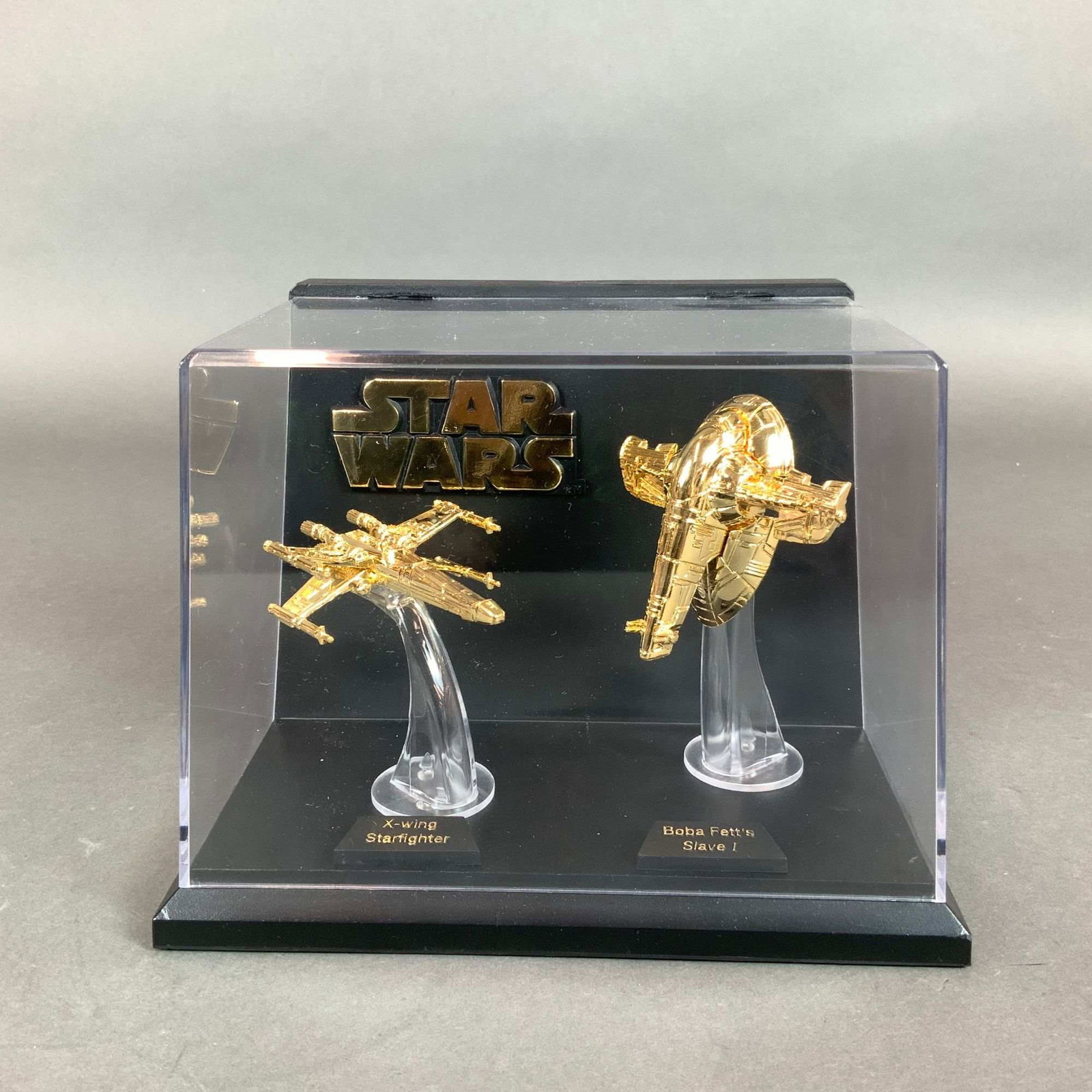 Package of Two Star Wars Miniature Starships in Display Case: This 1996 Star Wars collectible set is produced by Galoob as part of the Micro Machines line for Liberty Promotions. The set consists of a pair of 24 karat gold-plated miniature starships, identified 