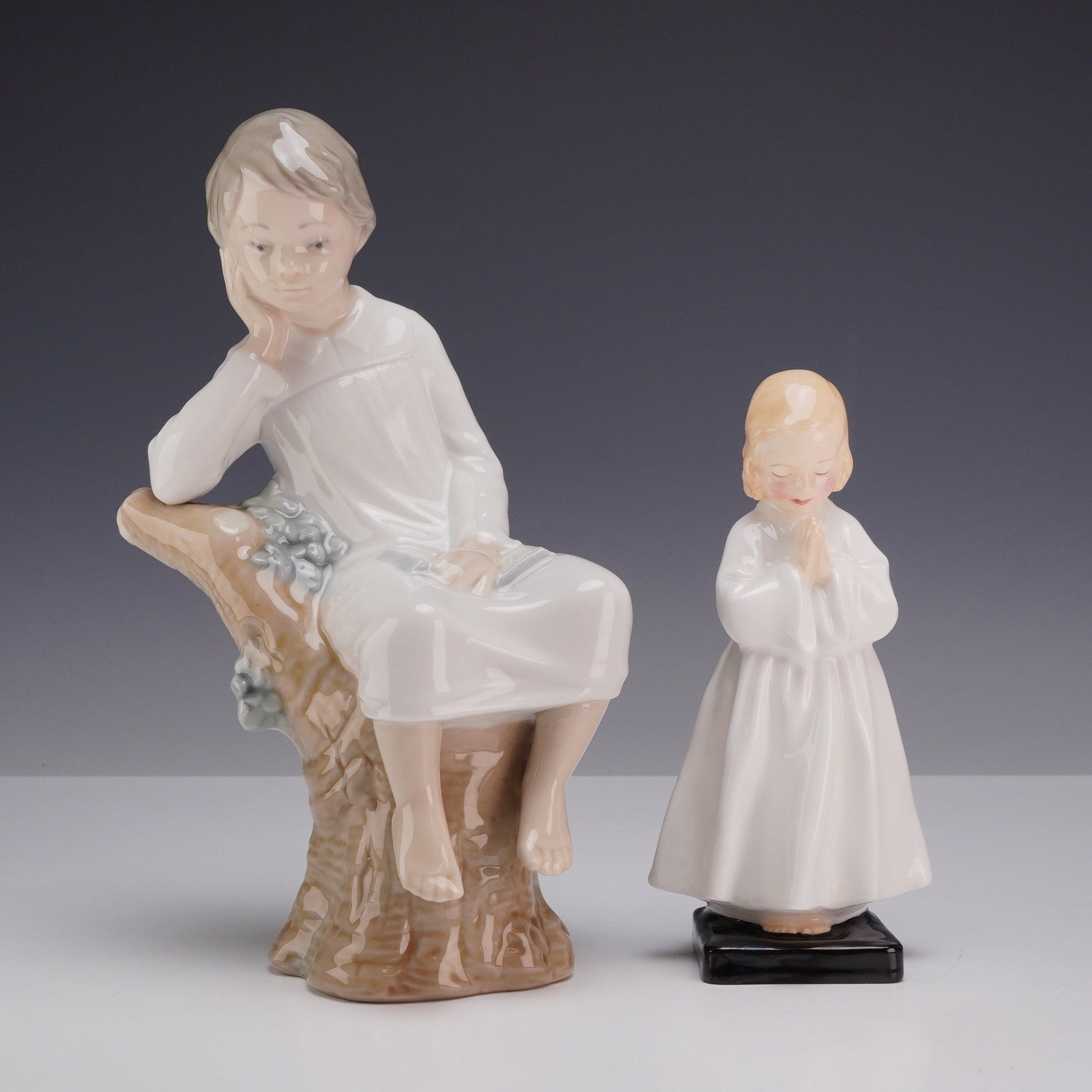 Two Porcelain Figurines Including Lladro Little Boy Thinking and Royal Doulton Bedtime (1 of 3)