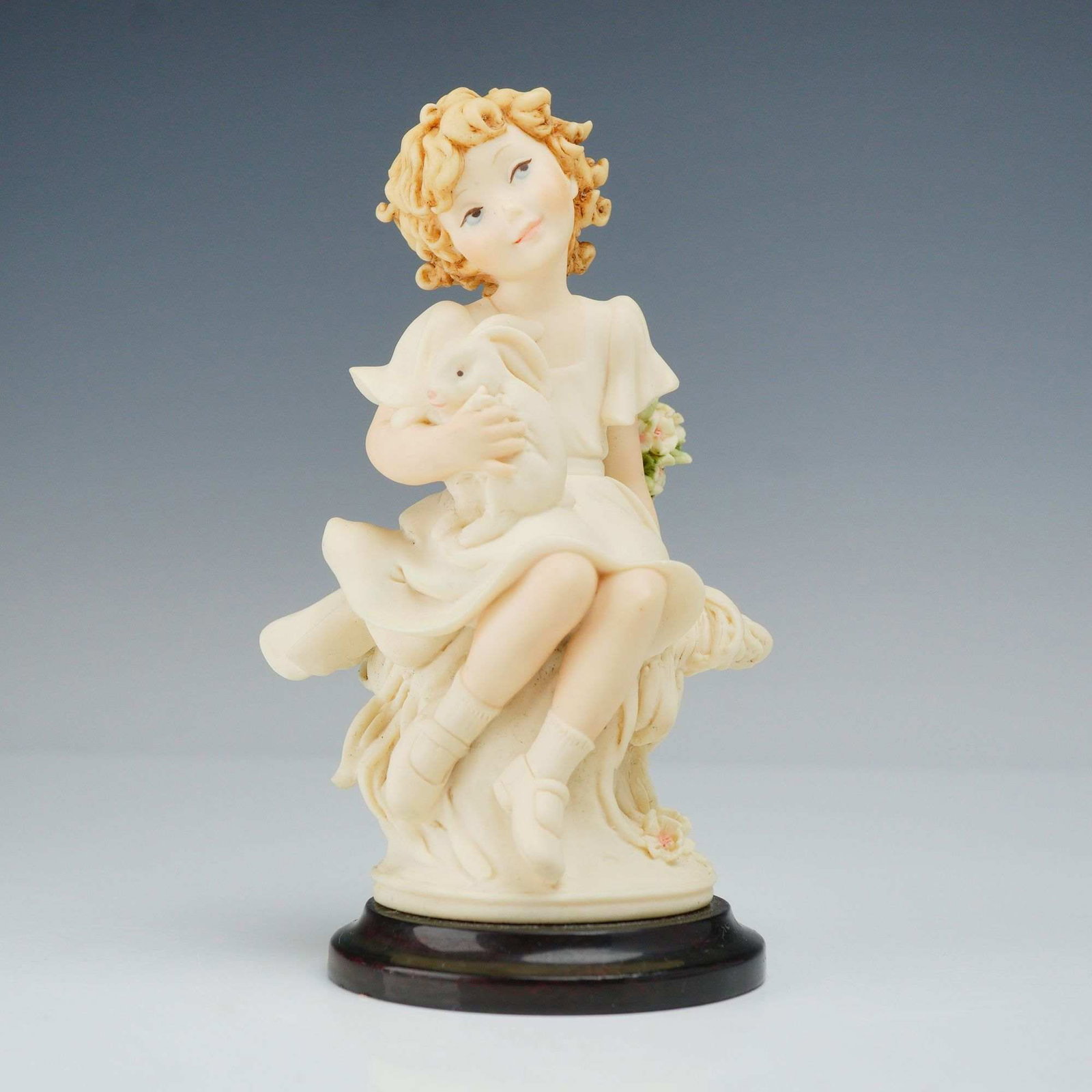 Giuseppe Armani Florence Sculture d'Arte My Friend Figurine 1542F: A Giuseppe Armani figurine titled My Friend, model number 1542F, produced for Florence Sculture d'Arte as part of The Society 2002 collection. The sculpture depicts a seated young girl with blonde cur